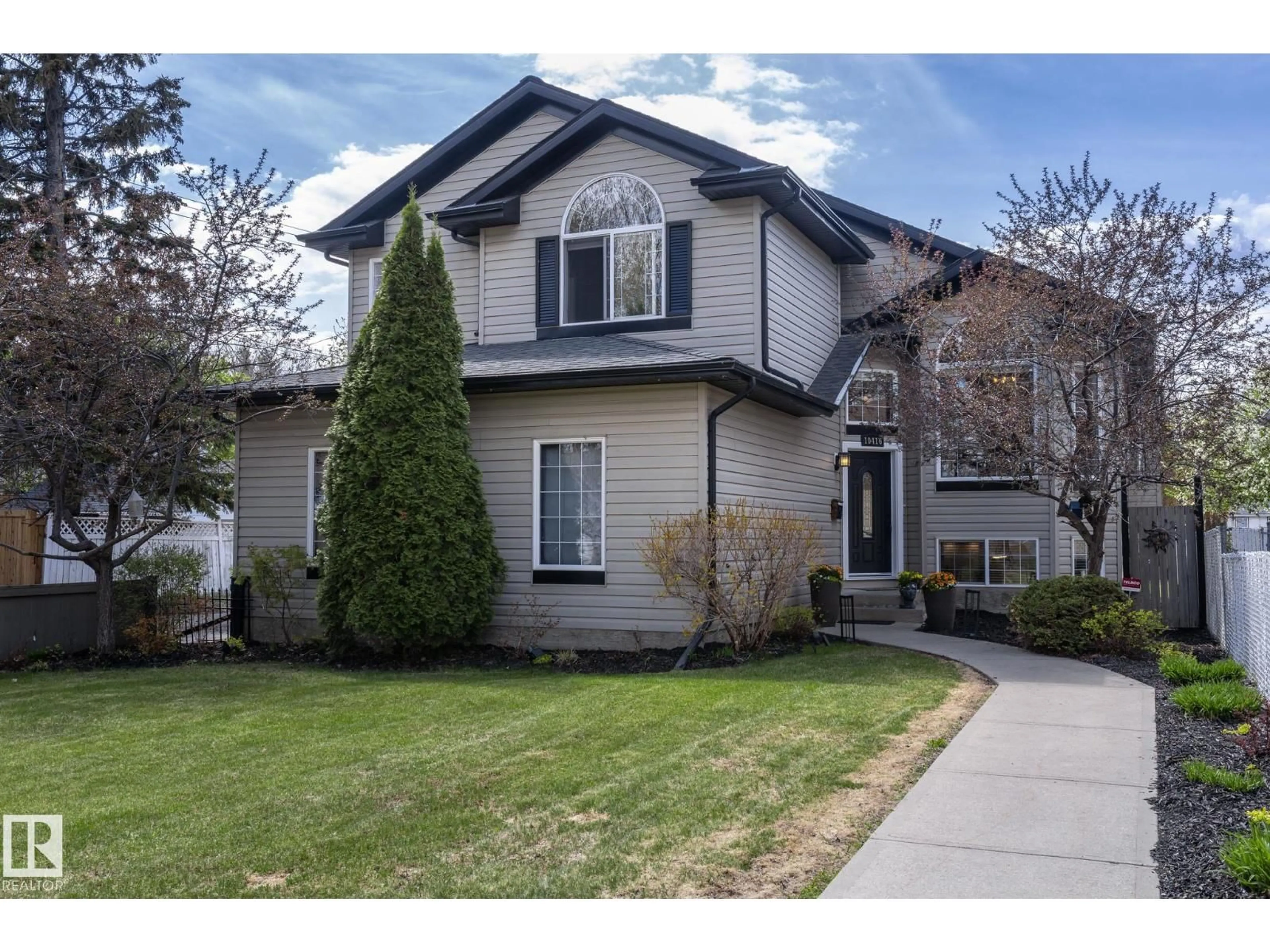 Home with vinyl exterior material, street for 10416 148 ST, Edmonton Alberta T5N3G8