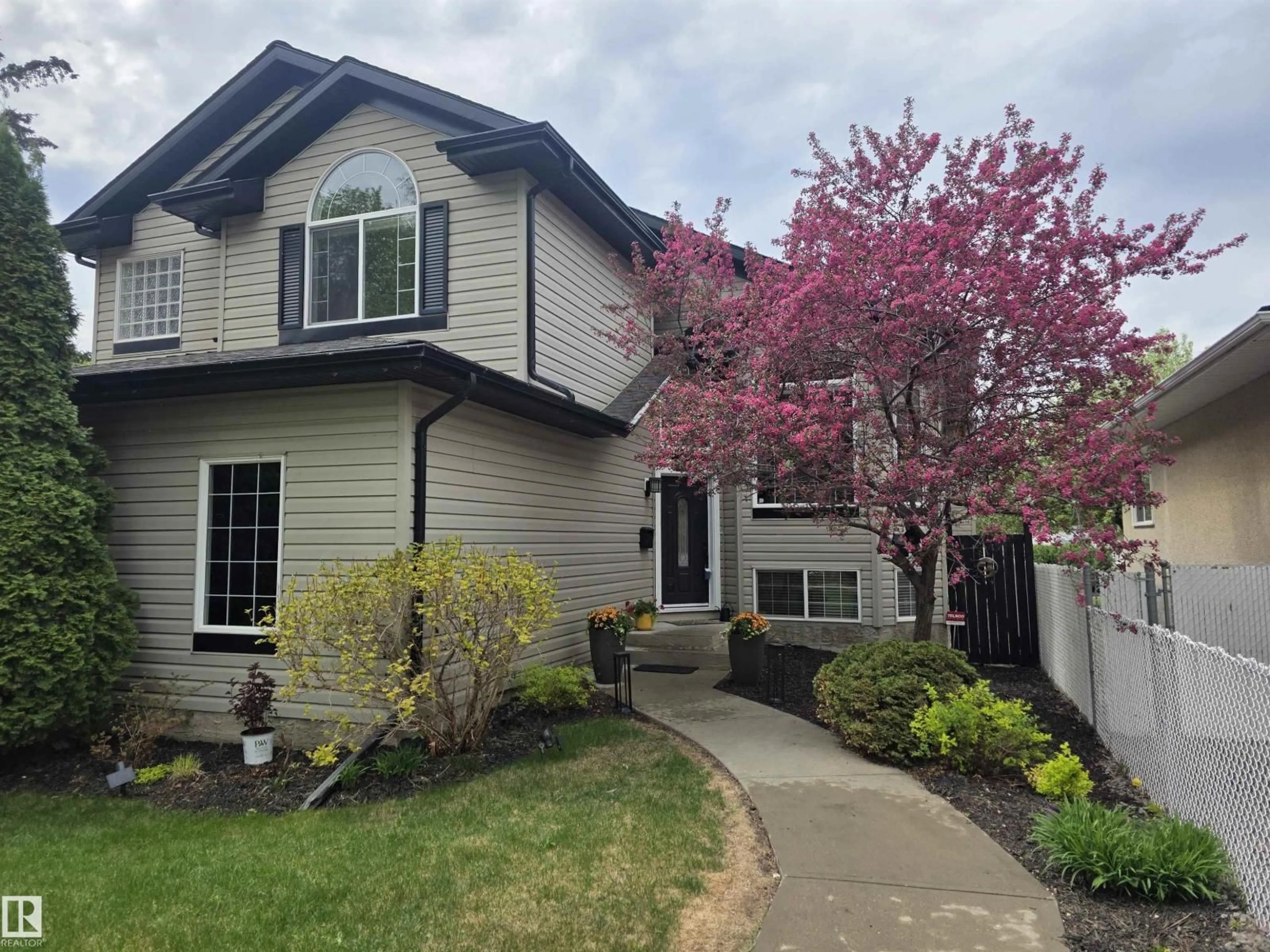 Home with vinyl exterior material, street for 10416 148 ST, Edmonton Alberta T5N3G8
