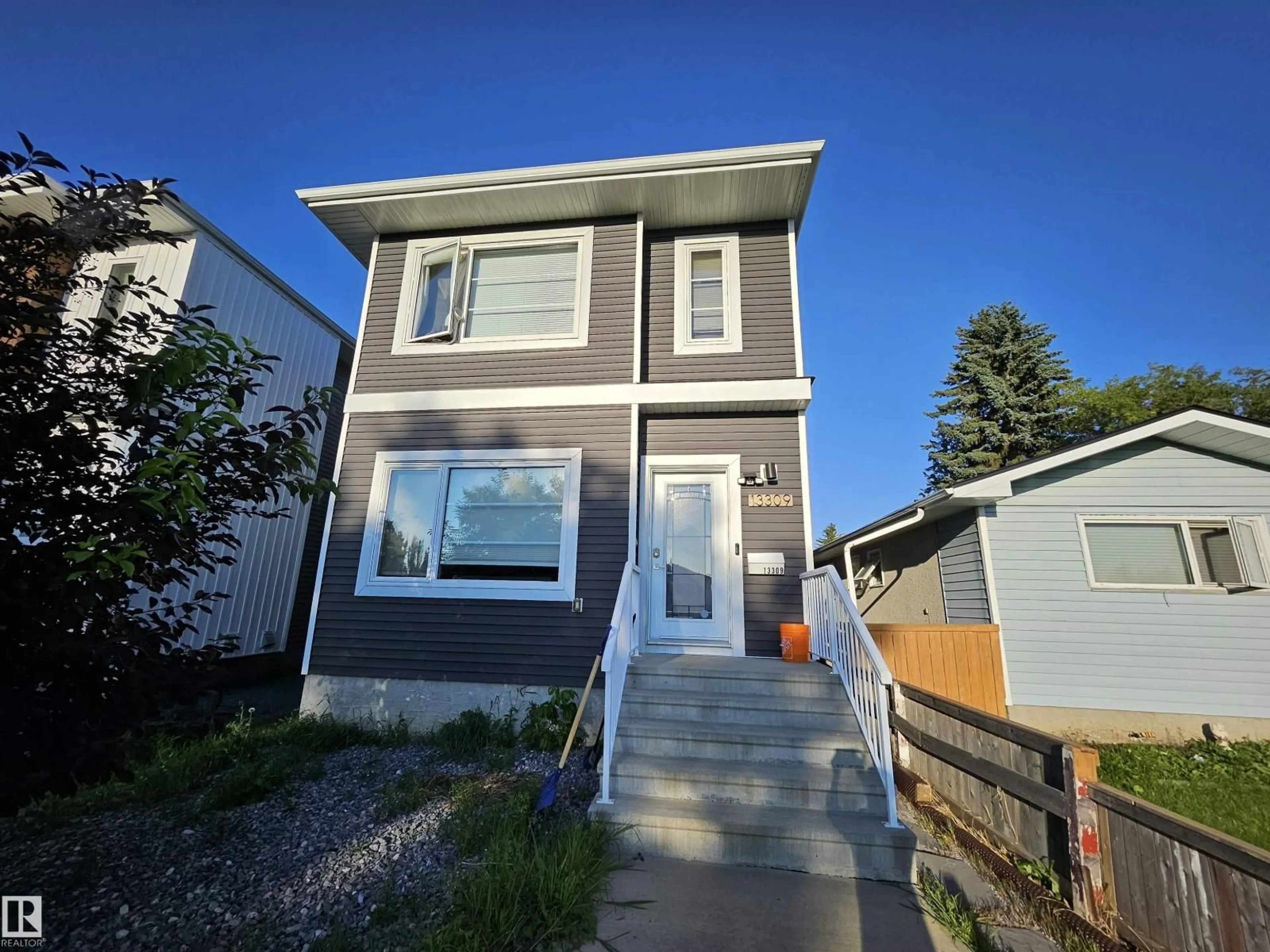 Home with vinyl exterior material, street for 13309 104 ST, Edmonton Alberta T5E4P2
