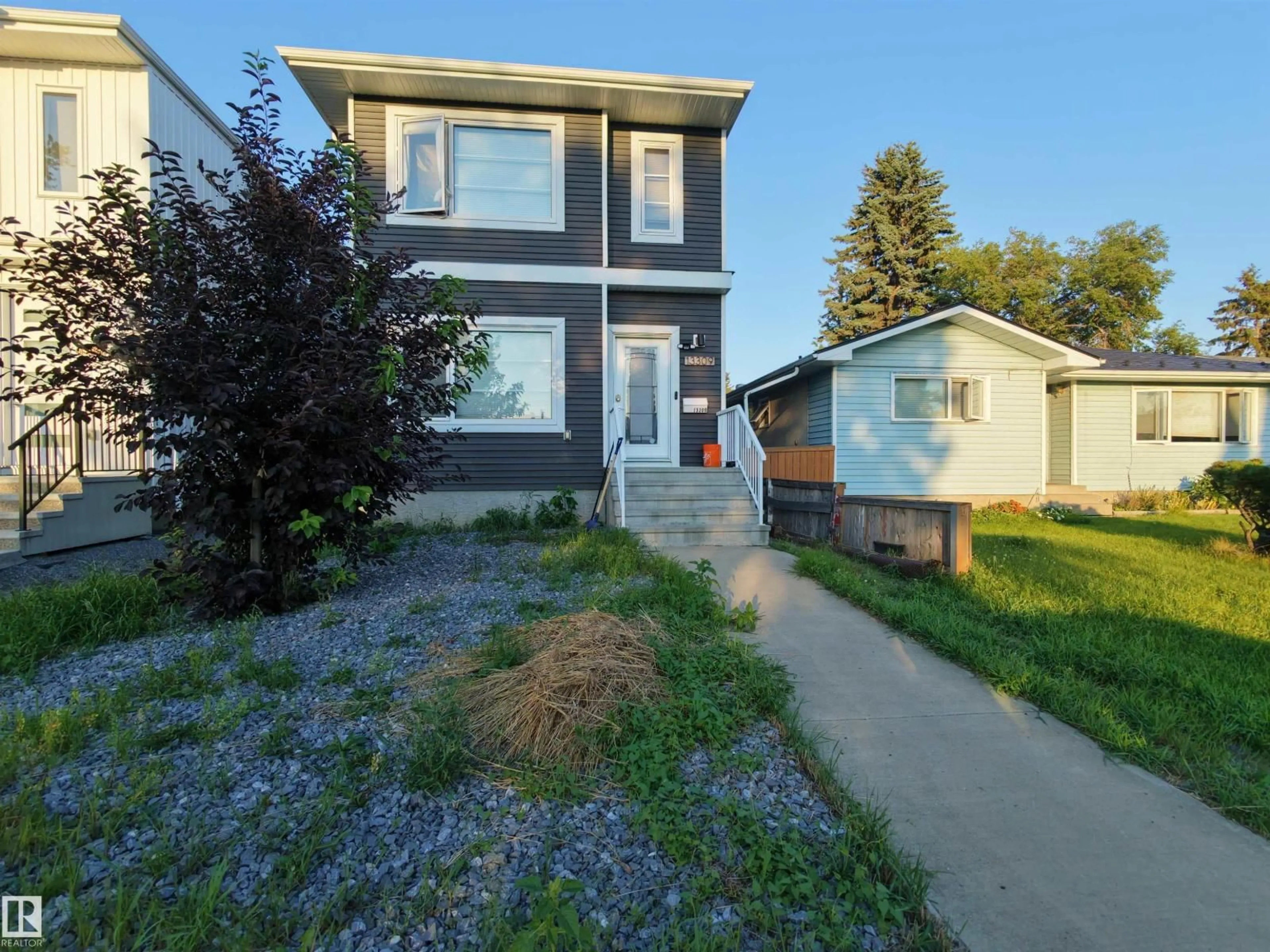 Home with vinyl exterior material, street for 13309 104 ST, Edmonton Alberta T5E4P2