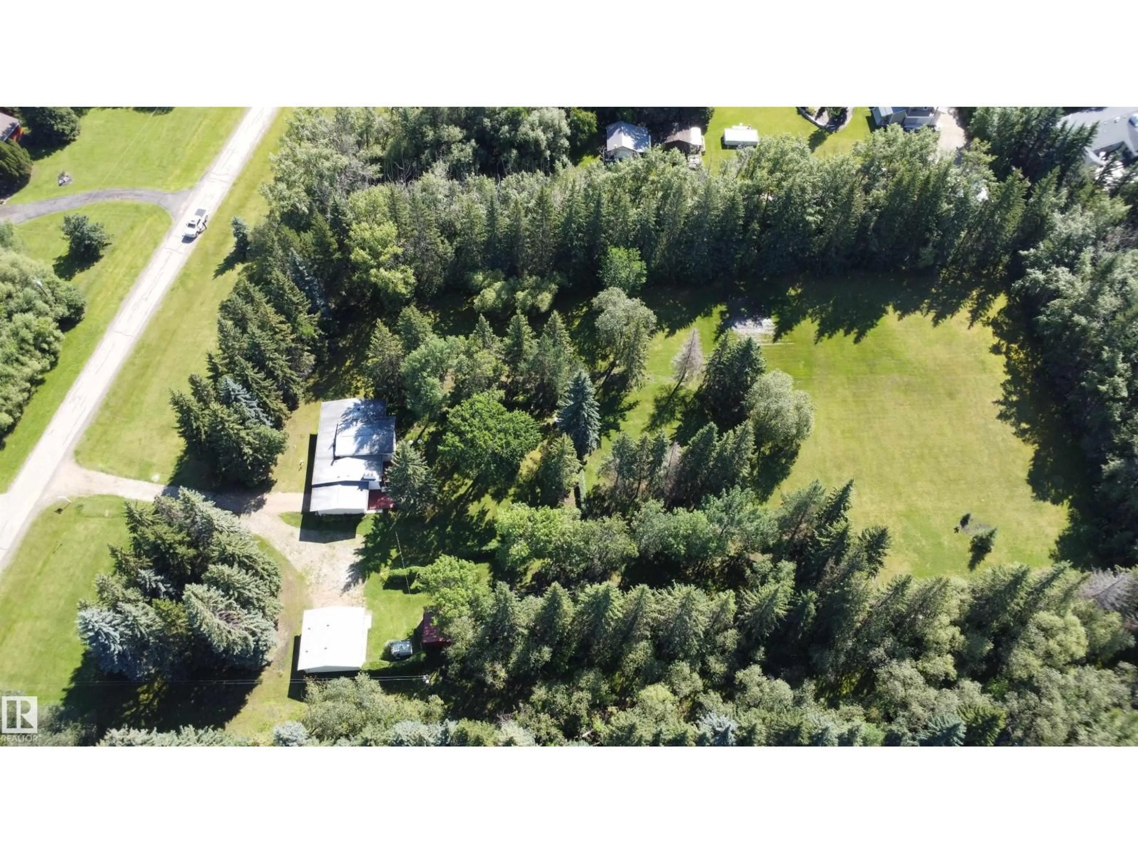 A pic from outside/outdoor area/front of a property/back of a property/a pic from drone, forest/trees view for 5 - 54015 RGE ROAD 262, Rural Sturgeon County Alberta T8T0A4