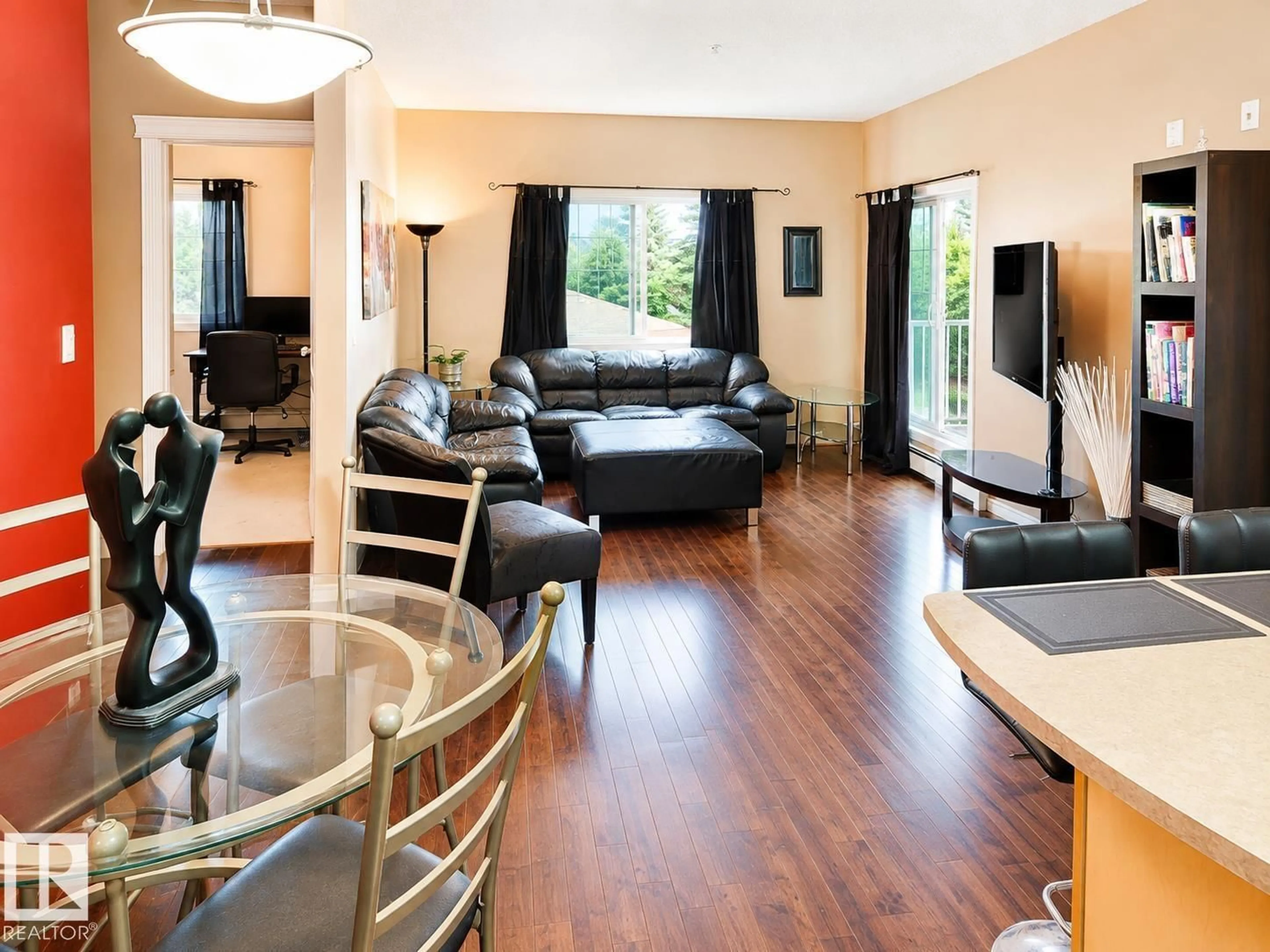 Living room with furniture, wood/laminate floor for 202 - 16715 100 AV, Edmonton Alberta T5P4Z5
