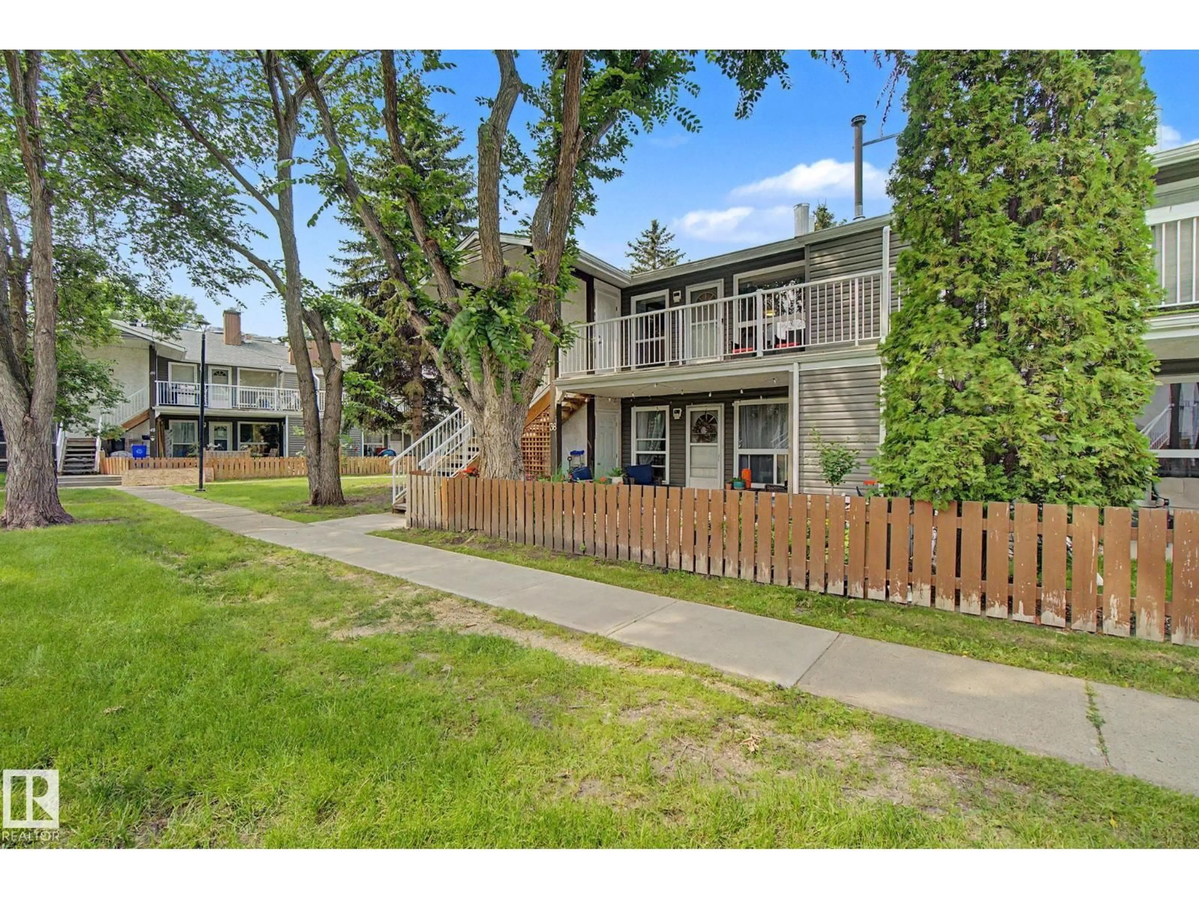 A pic from outside/outdoor area/front of a property/back of a property/a pic from drone, street for 39 - 3111 142 AV NW, Edmonton Alberta T5Y2H6