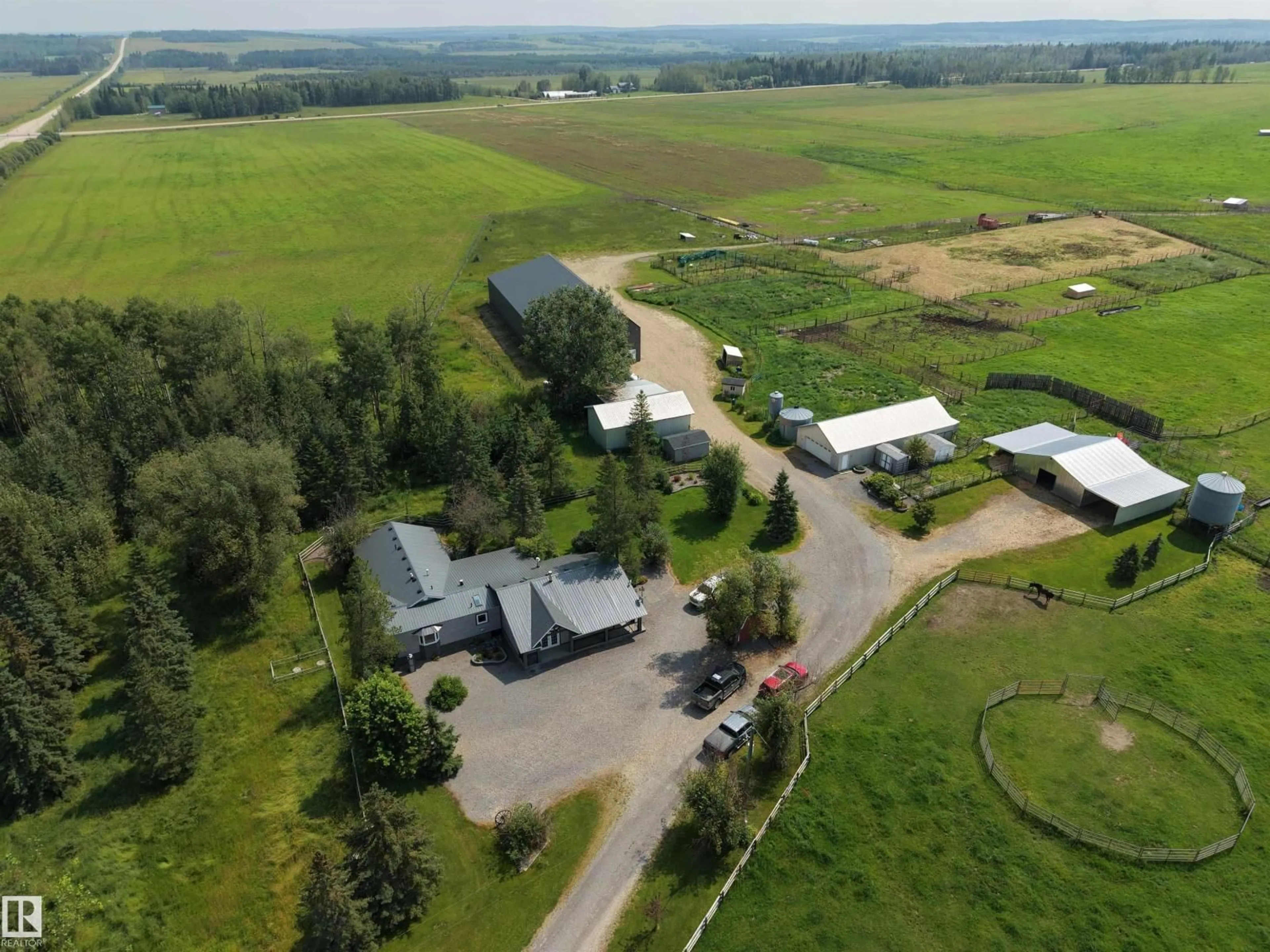 A pic from outside/outdoor area/front of a property/back of a property/a pic from drone, mountain view for 70037 HWY 13, Rural Wetaskiwin County Alberta T0C0A0