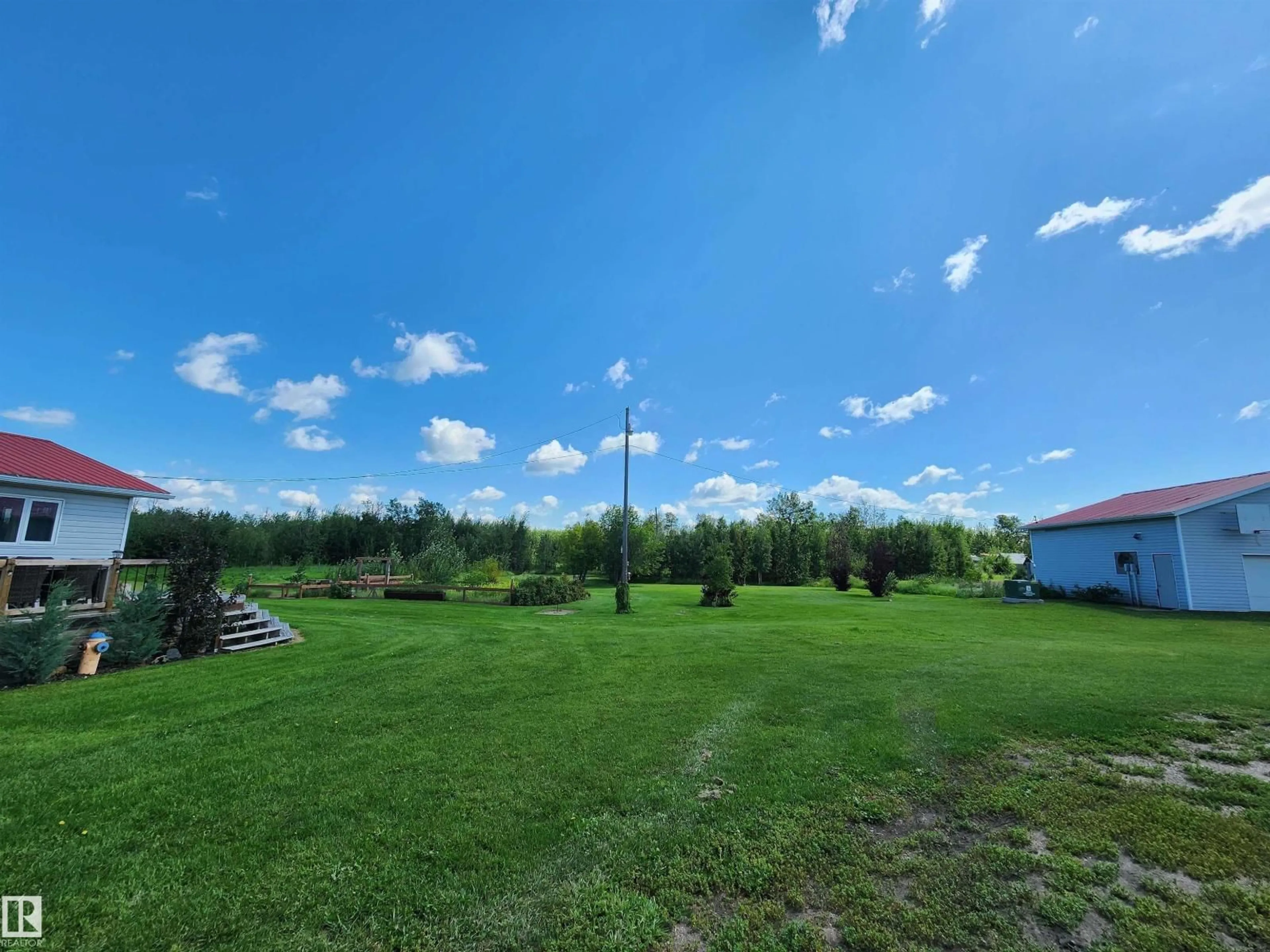 A pic from outside/outdoor area/front of a property/back of a property/a pic from drone, water/lake/river/ocean view for 56223 RGE ROAD 33, Rural Lac Ste. Anne County Alberta T0E1A0