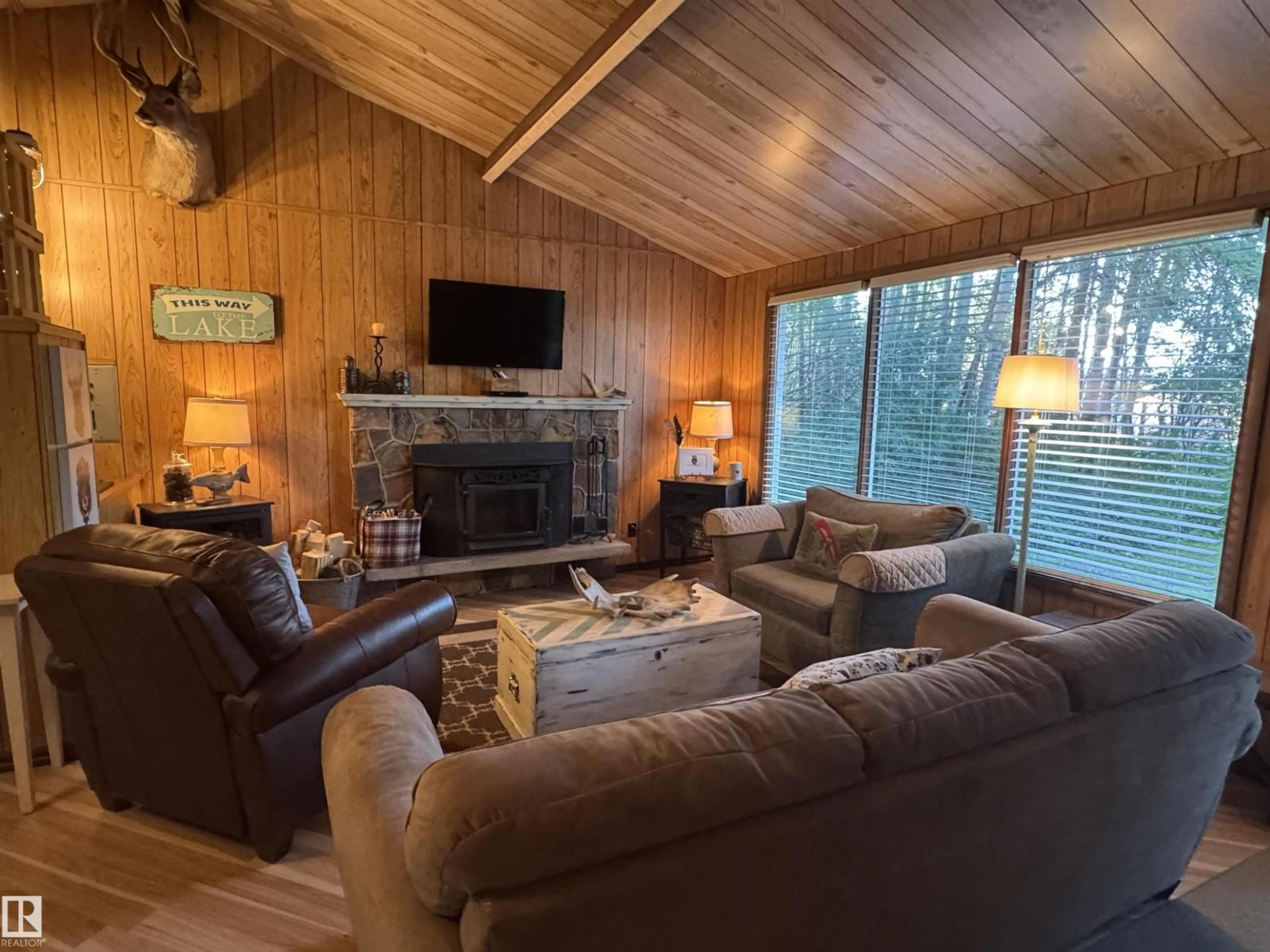 Living room with furniture, wood/laminate floor for 137 CRYSTAL SPRINGS DR, Rural Wetaskiwin County Alberta T0C2V0