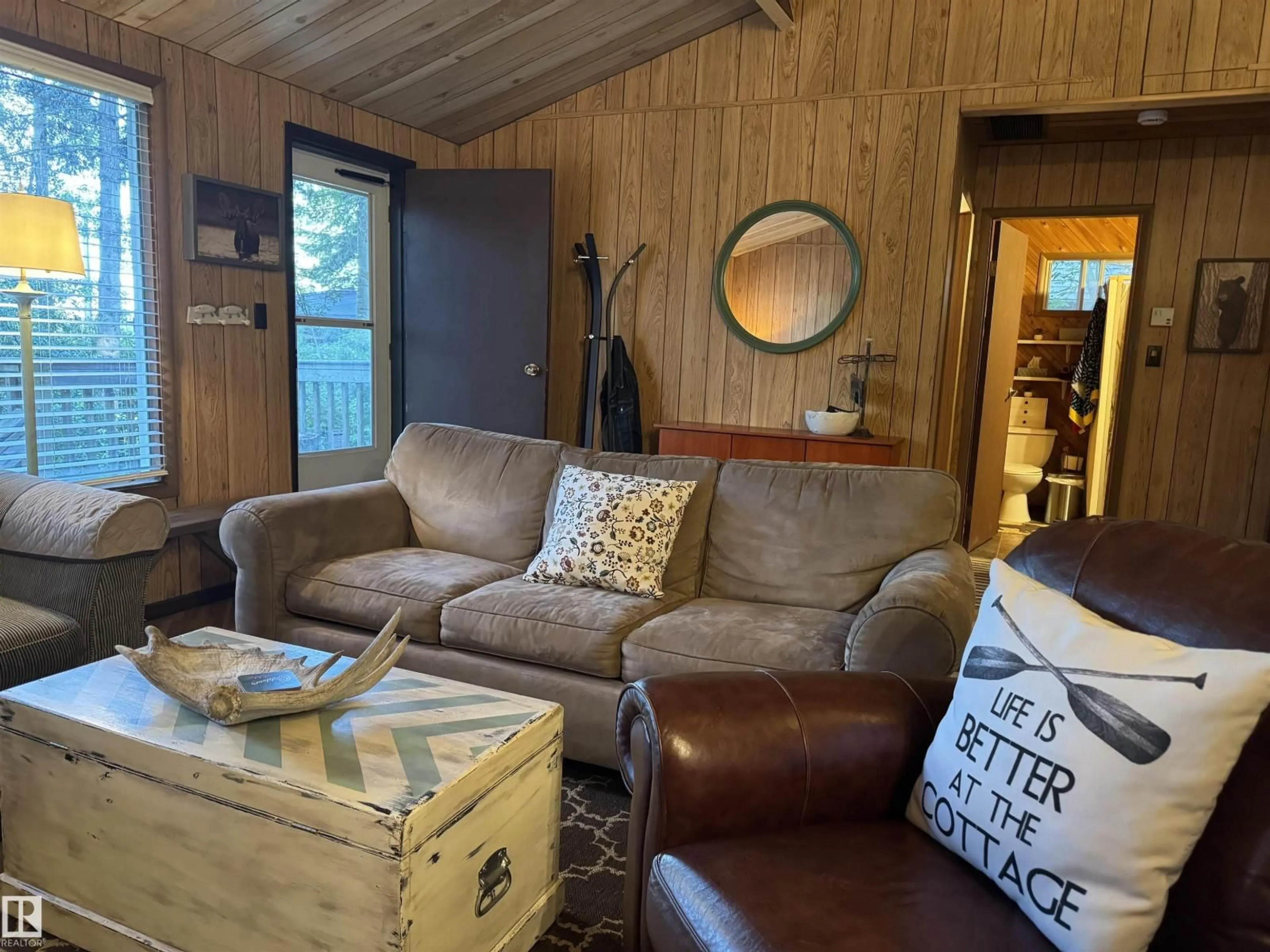Living room with furniture, wood/laminate floor for 137 CRYSTAL SPRINGS DR, Rural Wetaskiwin County Alberta T0C2V0