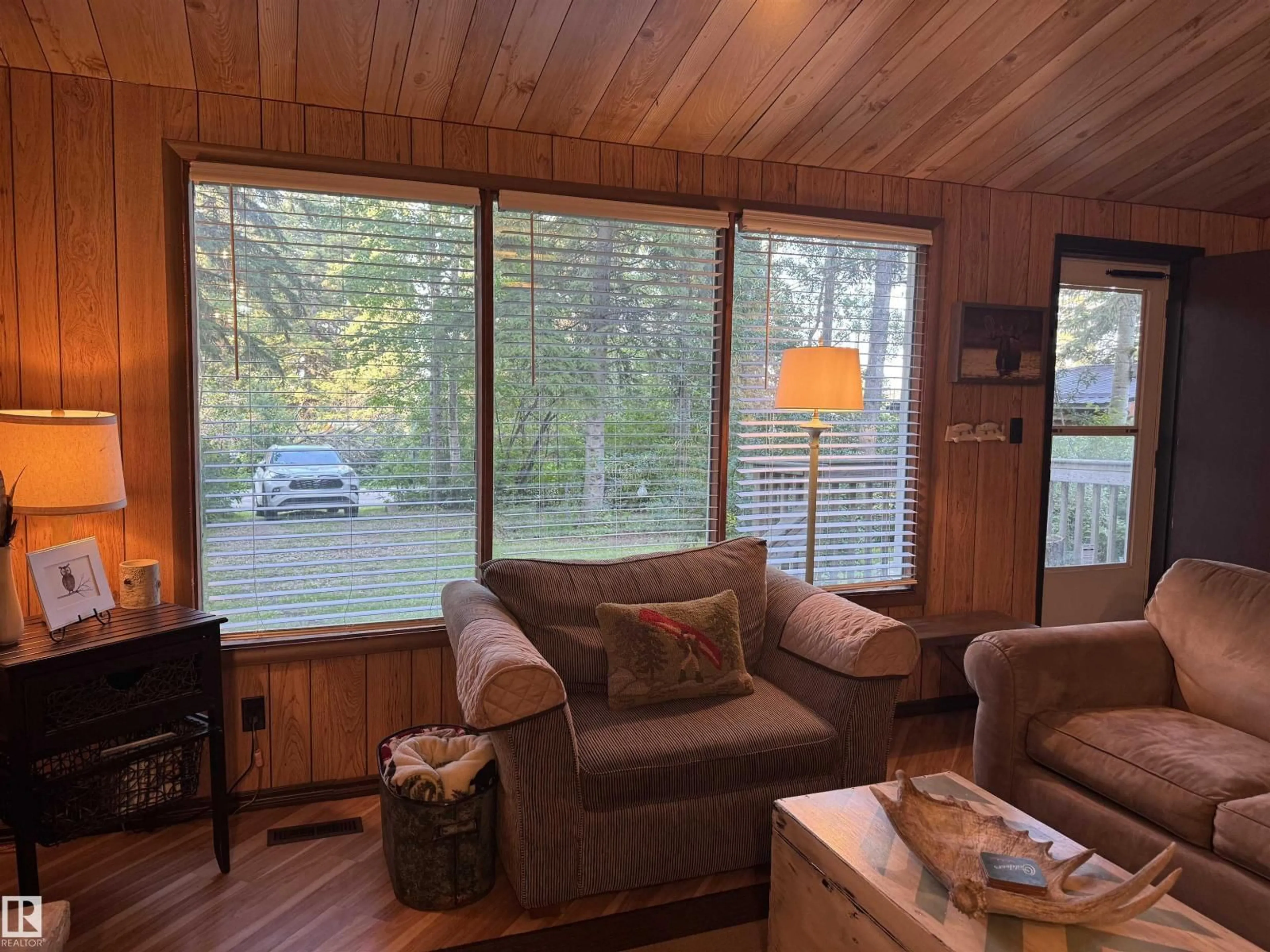 Living room with furniture, wood/laminate floor for 137 CRYSTAL SPRINGS DR, Rural Wetaskiwin County Alberta T0C2V0