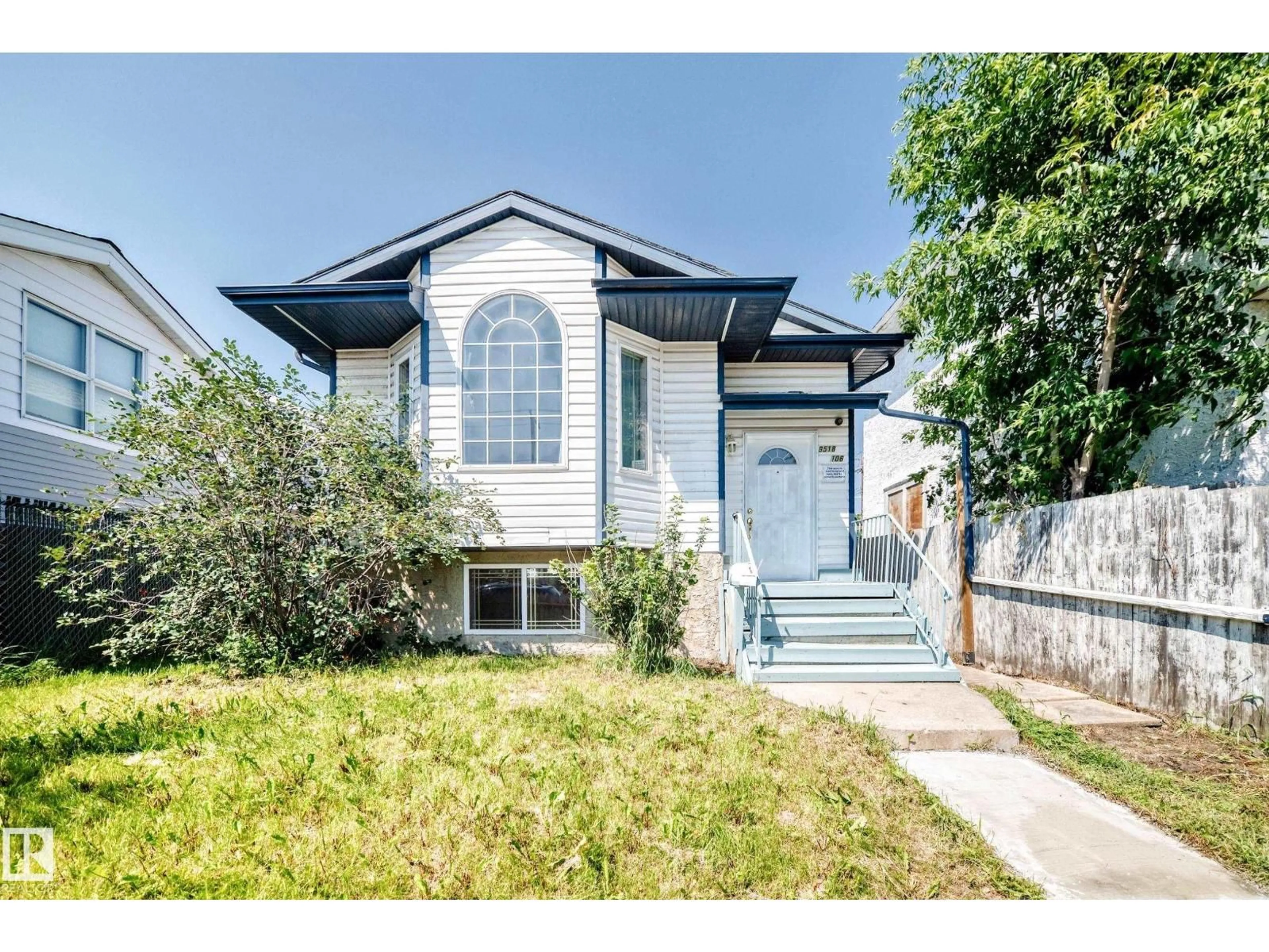 Home with vinyl exterior material, street for 9518 106 AV, Edmonton Alberta T5H0N2