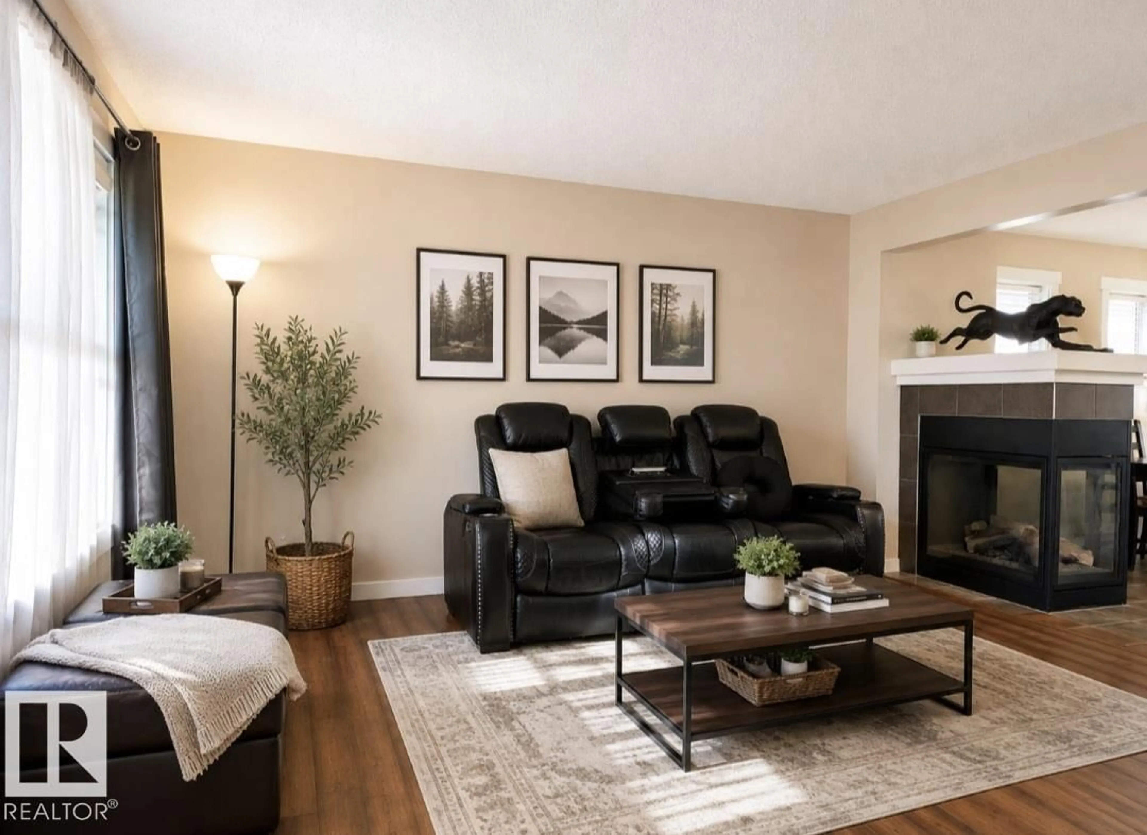 Living room with furniture, wood/laminate floor for 5135 1A AV SW, Edmonton Alberta T6X0X3