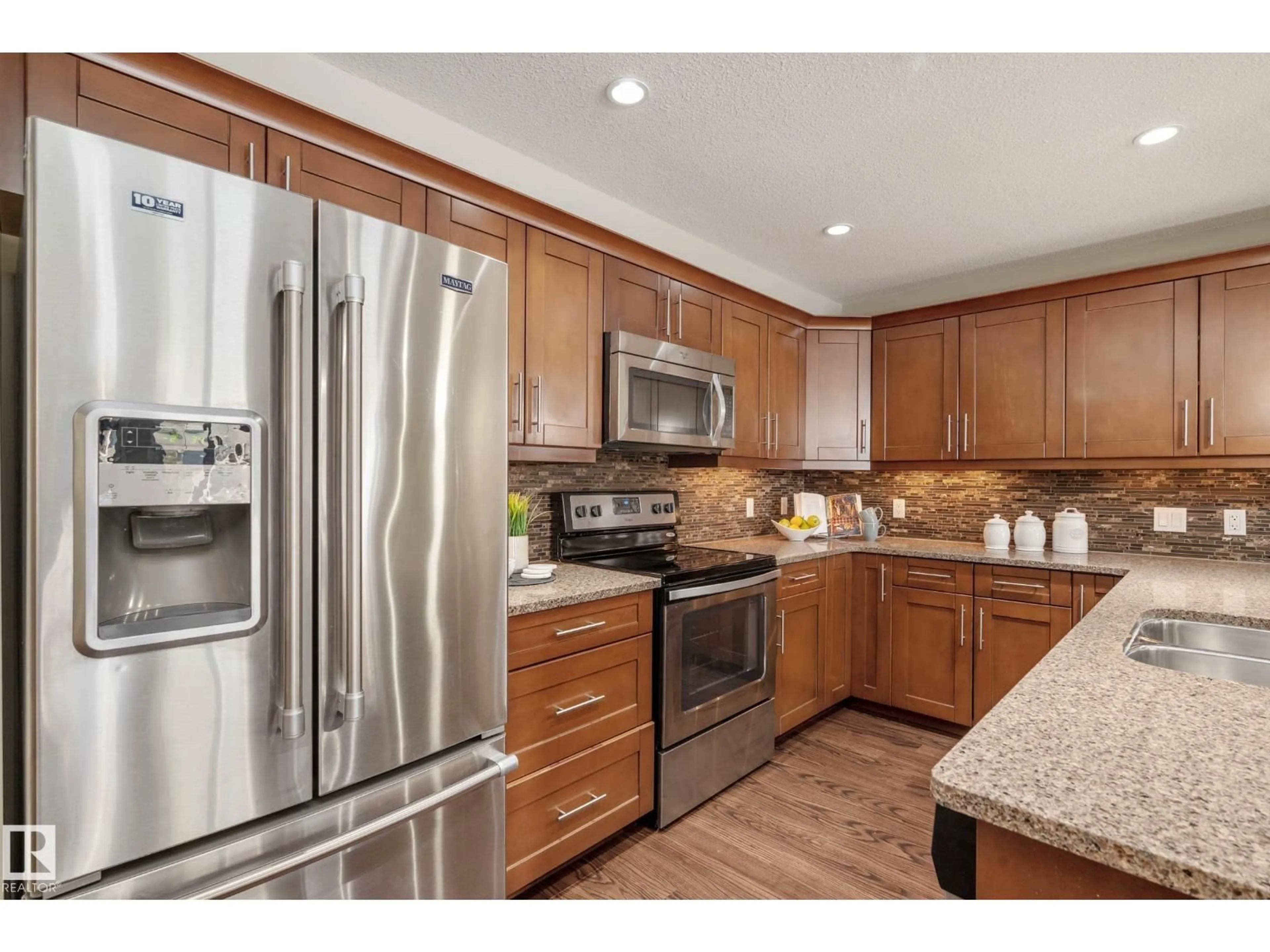 Open concept kitchen, unknown for #119 - 1031 173 ST, Edmonton Alberta T6W3E4