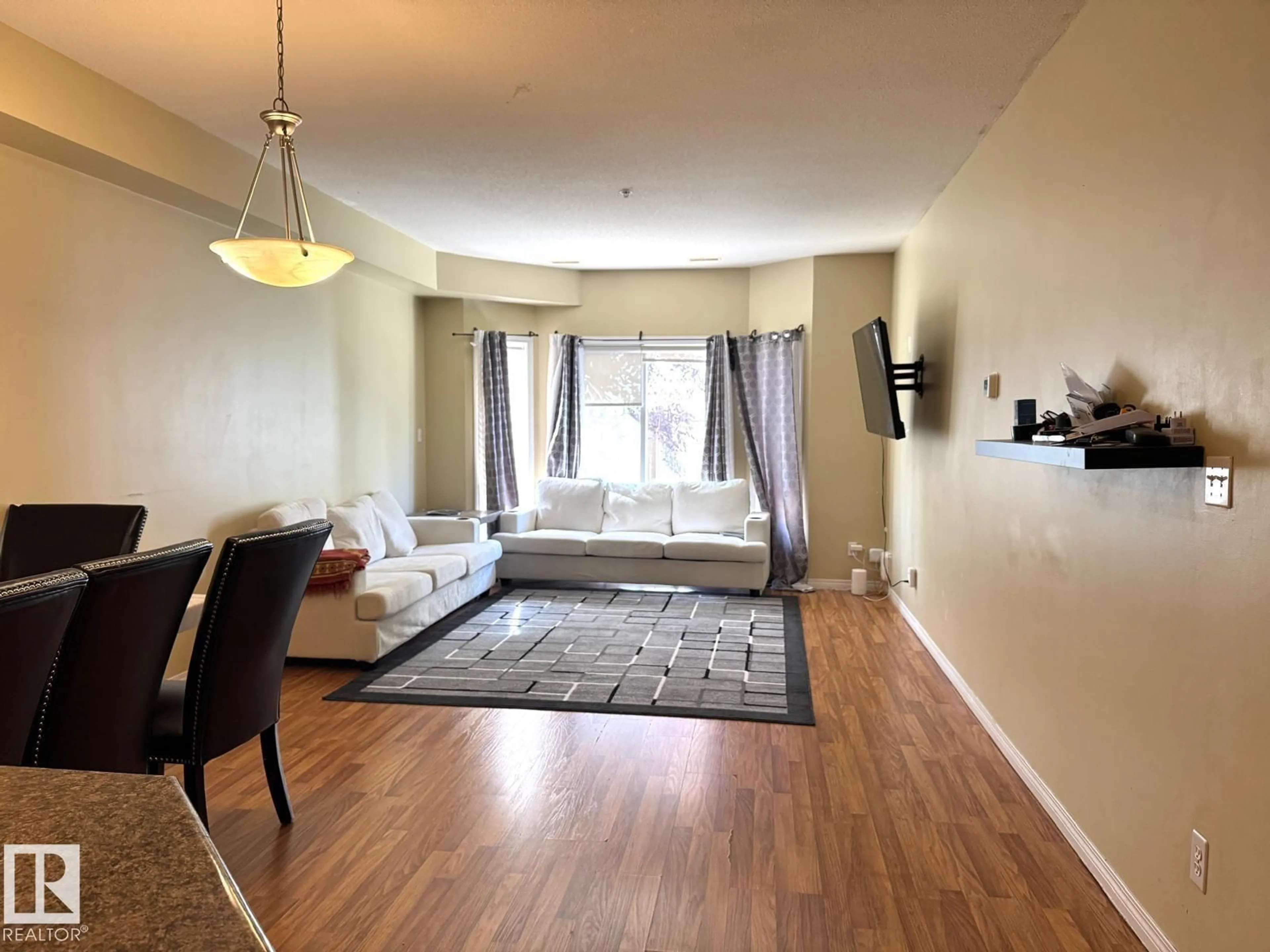 Living room with furniture, unknown for #117 - 4304 139 AV, Edmonton Alberta T5Y0H6