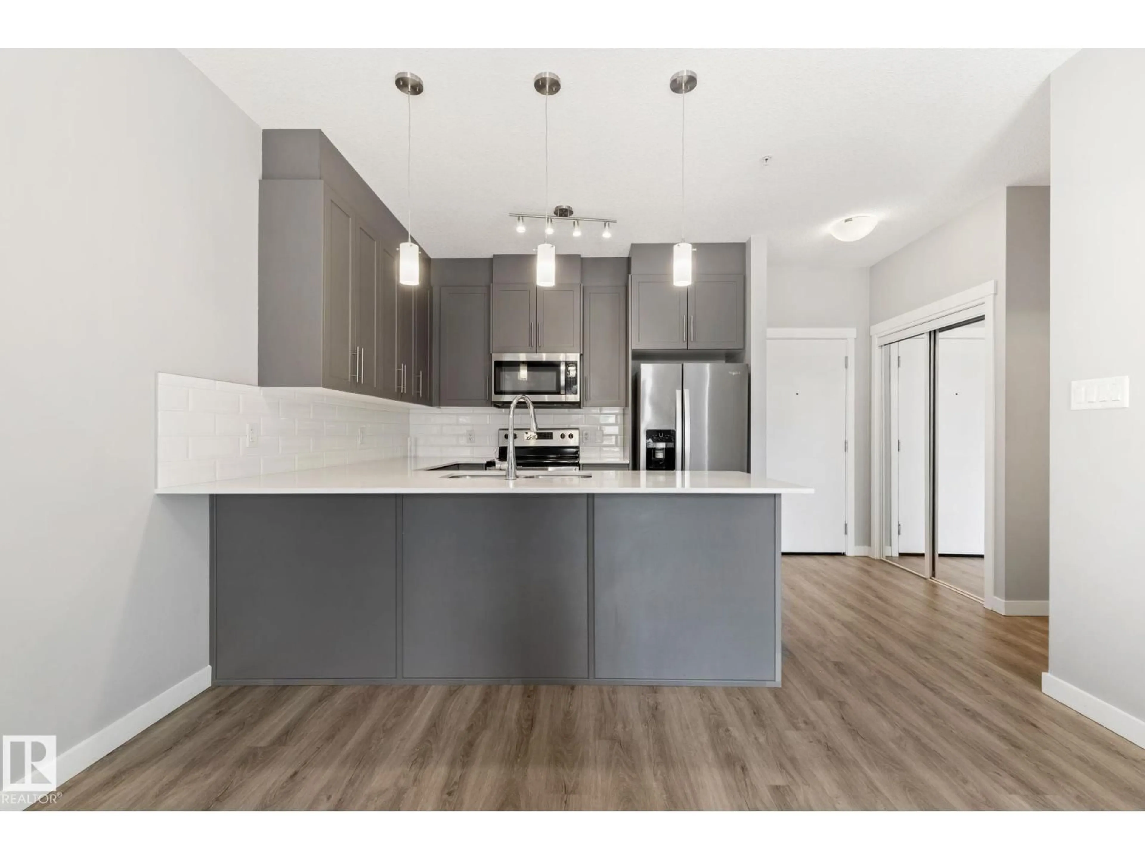 Open concept kitchen, wood/laminate floor for #121 - 121 WELSH DR, Edmonton Alberta T6X1Y7