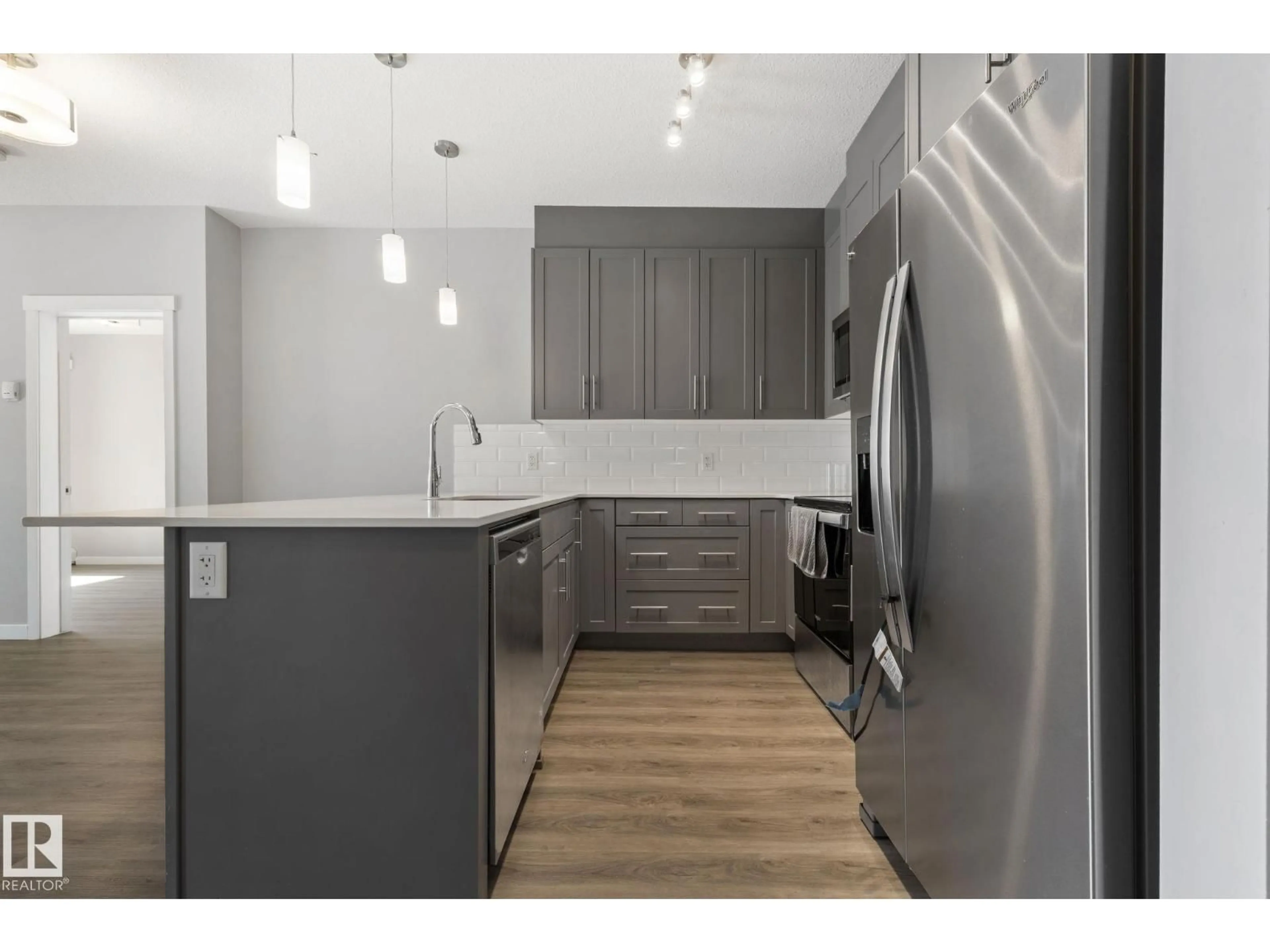 Open concept kitchen, wood/laminate floor for #121 - 121 WELSH DR, Edmonton Alberta T6X1Y7