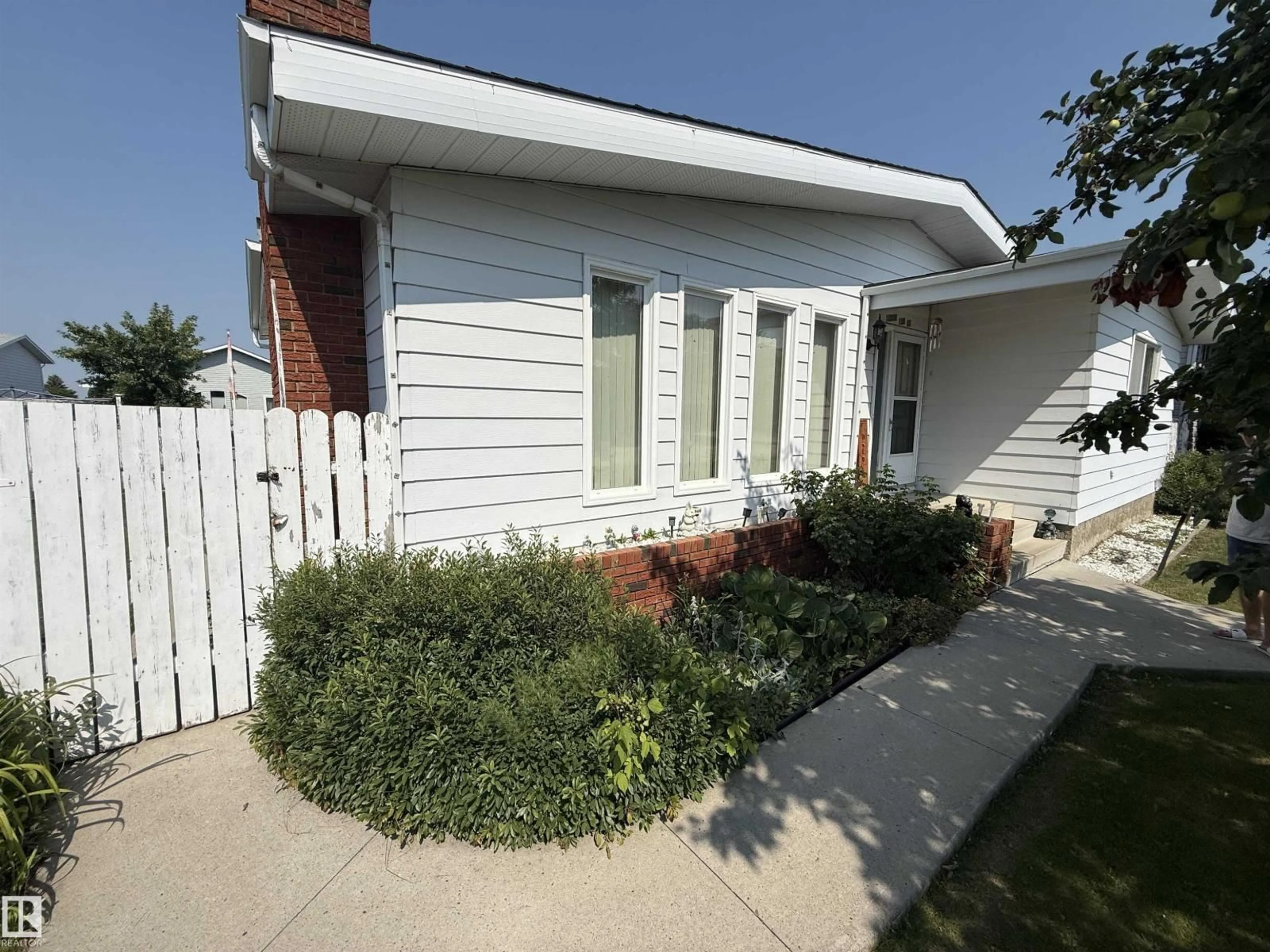 Home with vinyl exterior material, street for 10808 109 STREET, Westlock Alberta T7P1C4