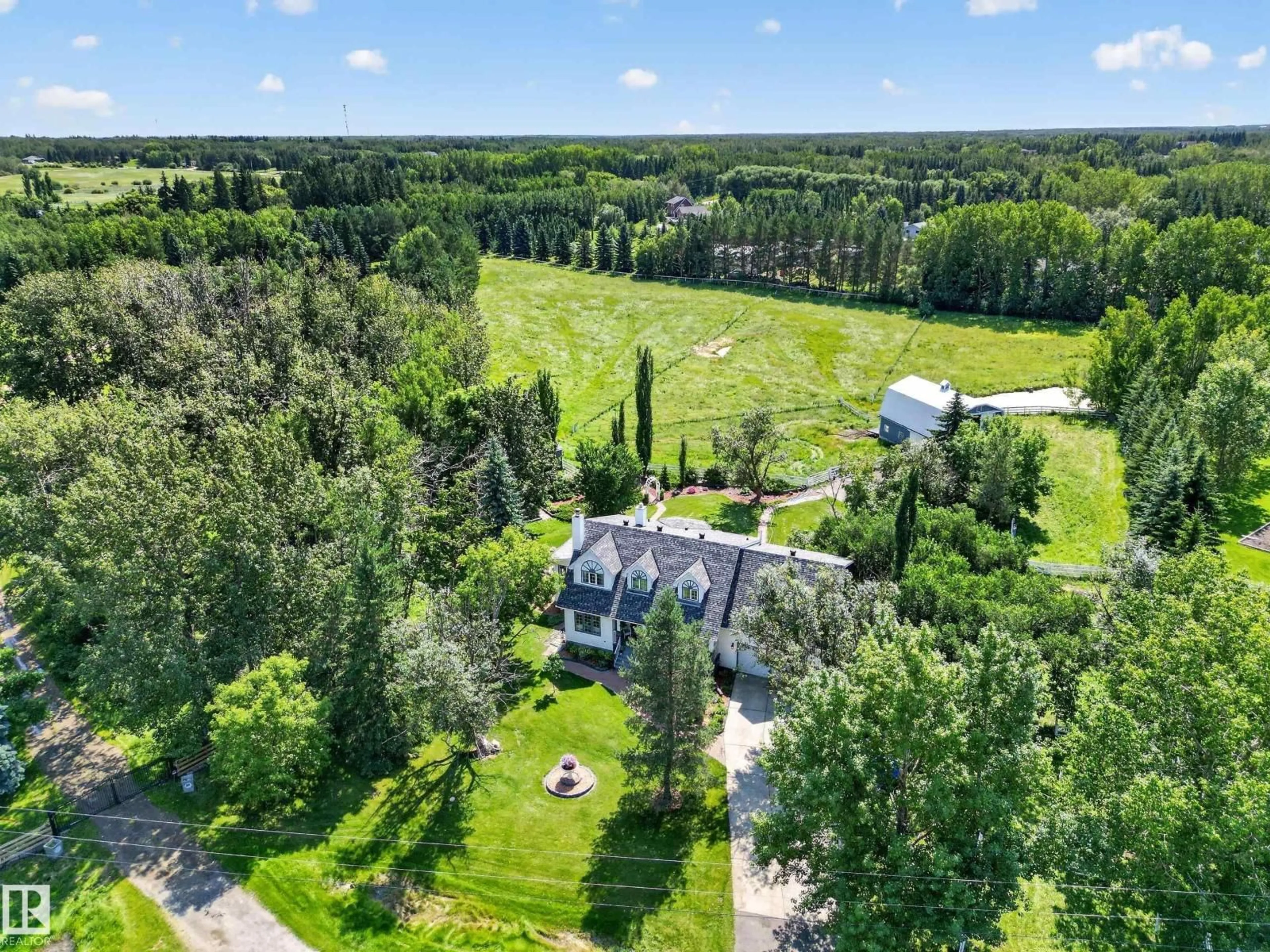 A pic from outside/outdoor area/front of a property/back of a property/a pic from drone, forest/trees view for 52514 - 86 RGE ROAD 223, Rural Strathcona County Alberta T8A4R2