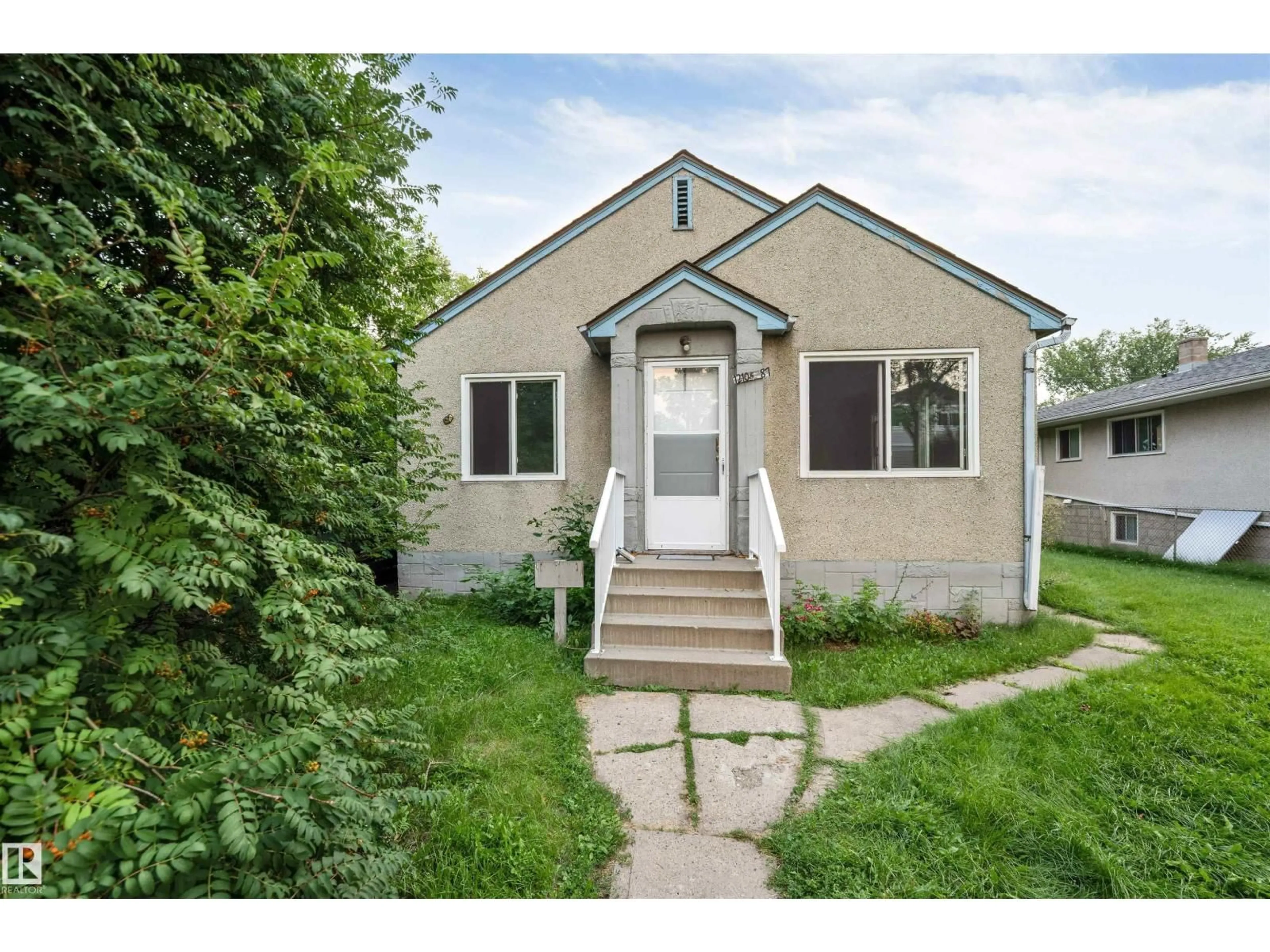 Home with vinyl exterior material, street for NW - 12105 87 ST, Edmonton Alberta T5B3N7