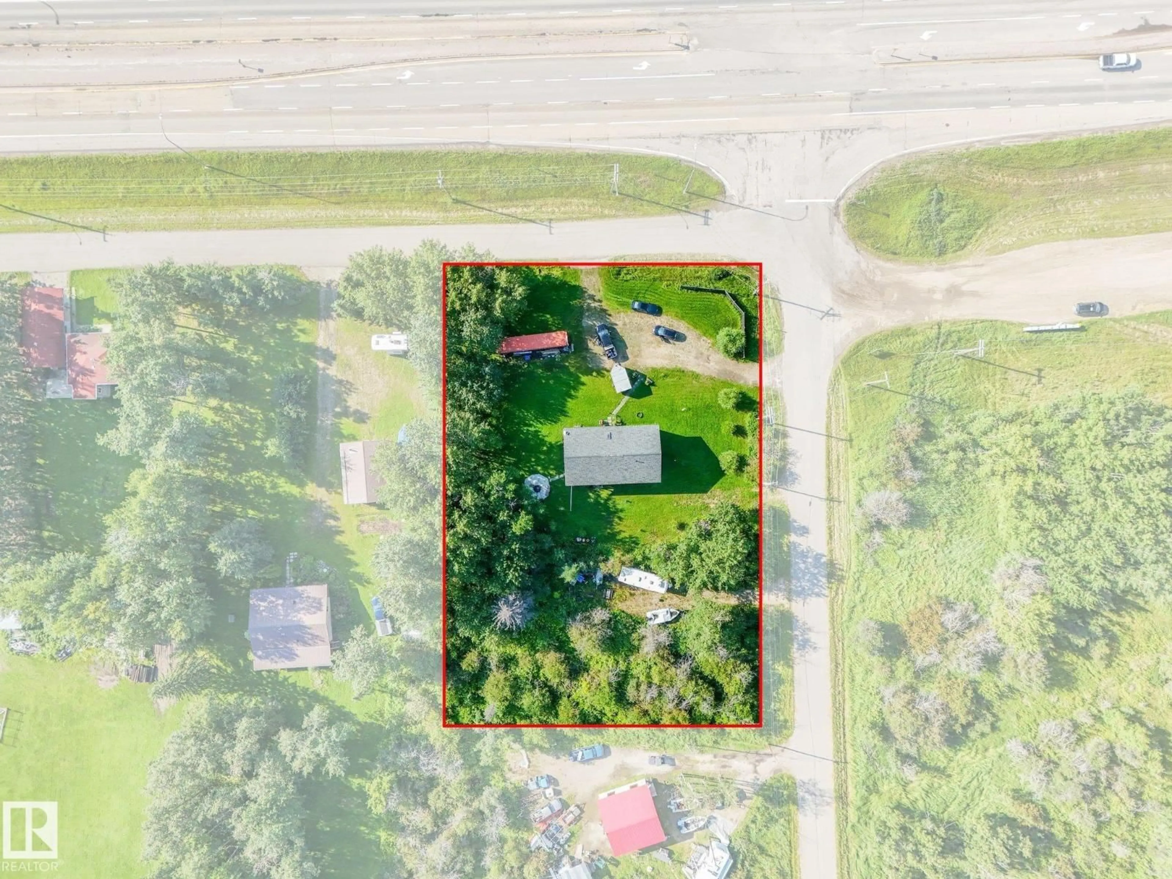 A pic from outside/outdoor area/front of a property/back of a property/a pic from drone, street for 6132 HGHWAY 16, Rural Parkland County Alberta T0E0W0