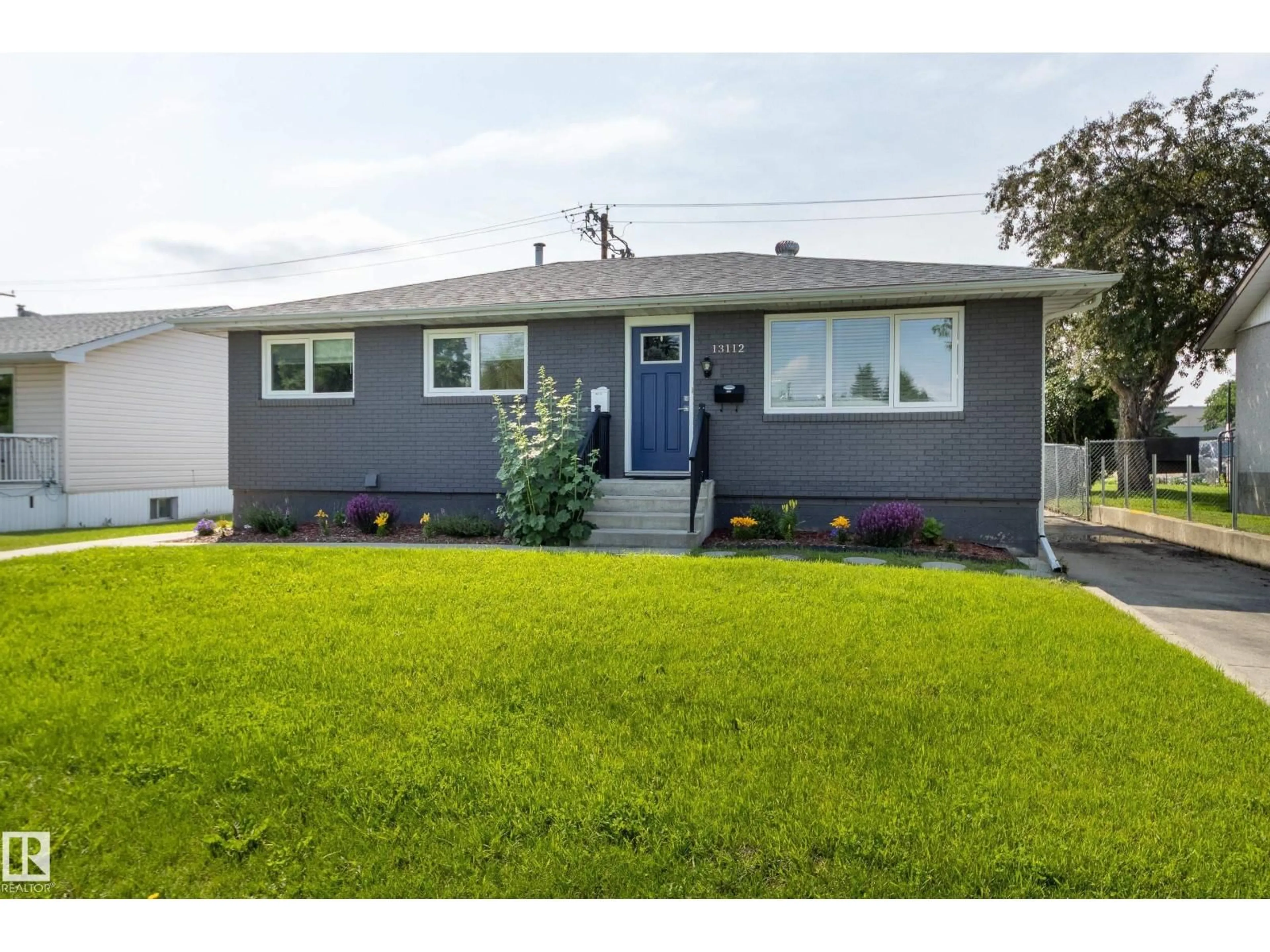 Home with vinyl exterior material, street for 13112 90 ST, Edmonton Alberta T5E3M5