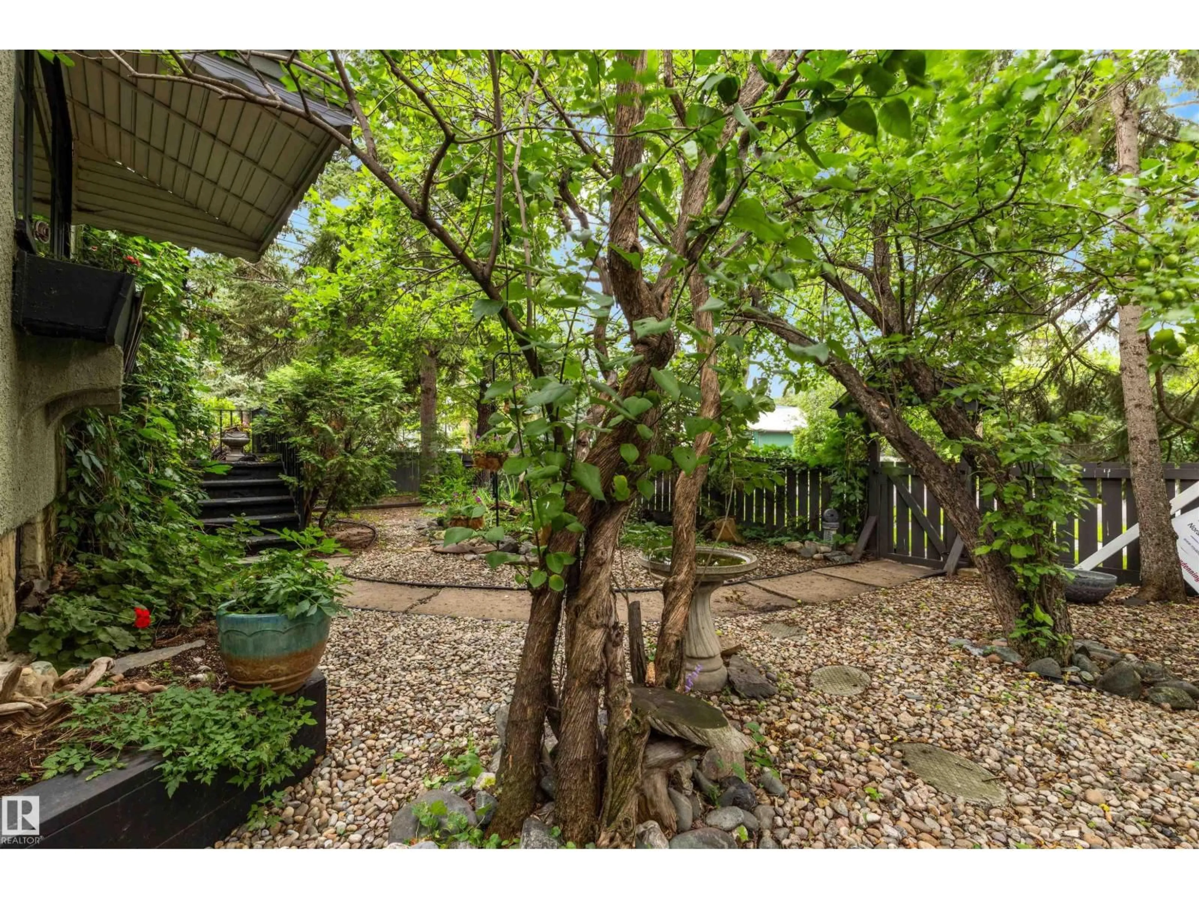 Patio, forest/trees view for 12220 109 AV, Edmonton Alberta T5M2E3