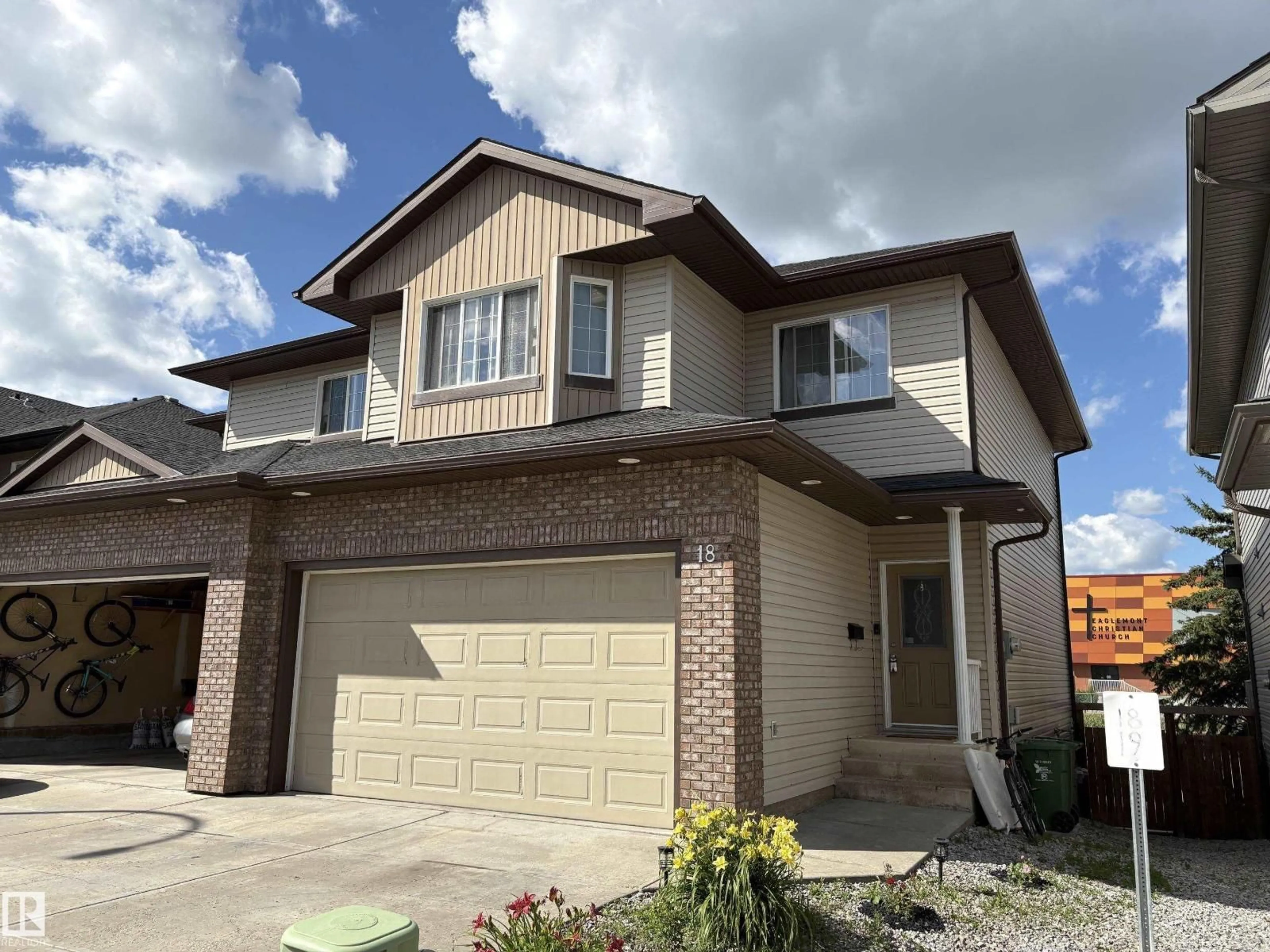 Home with brick exterior material, street for 18 - 4900 62 ST, Beaumont Alberta T4X0C6