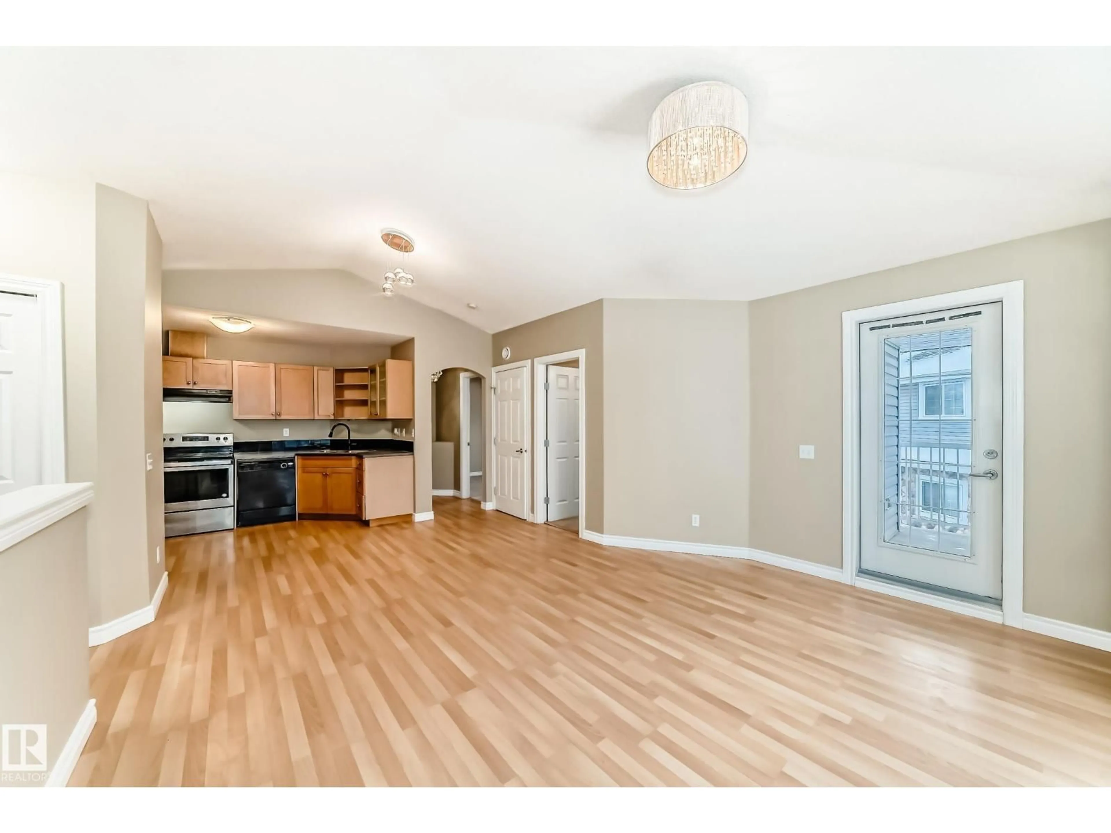 Open concept kitchen, wood/laminate floor for 48 150 EDWARDS DR, Edmonton Alberta T6X1M4