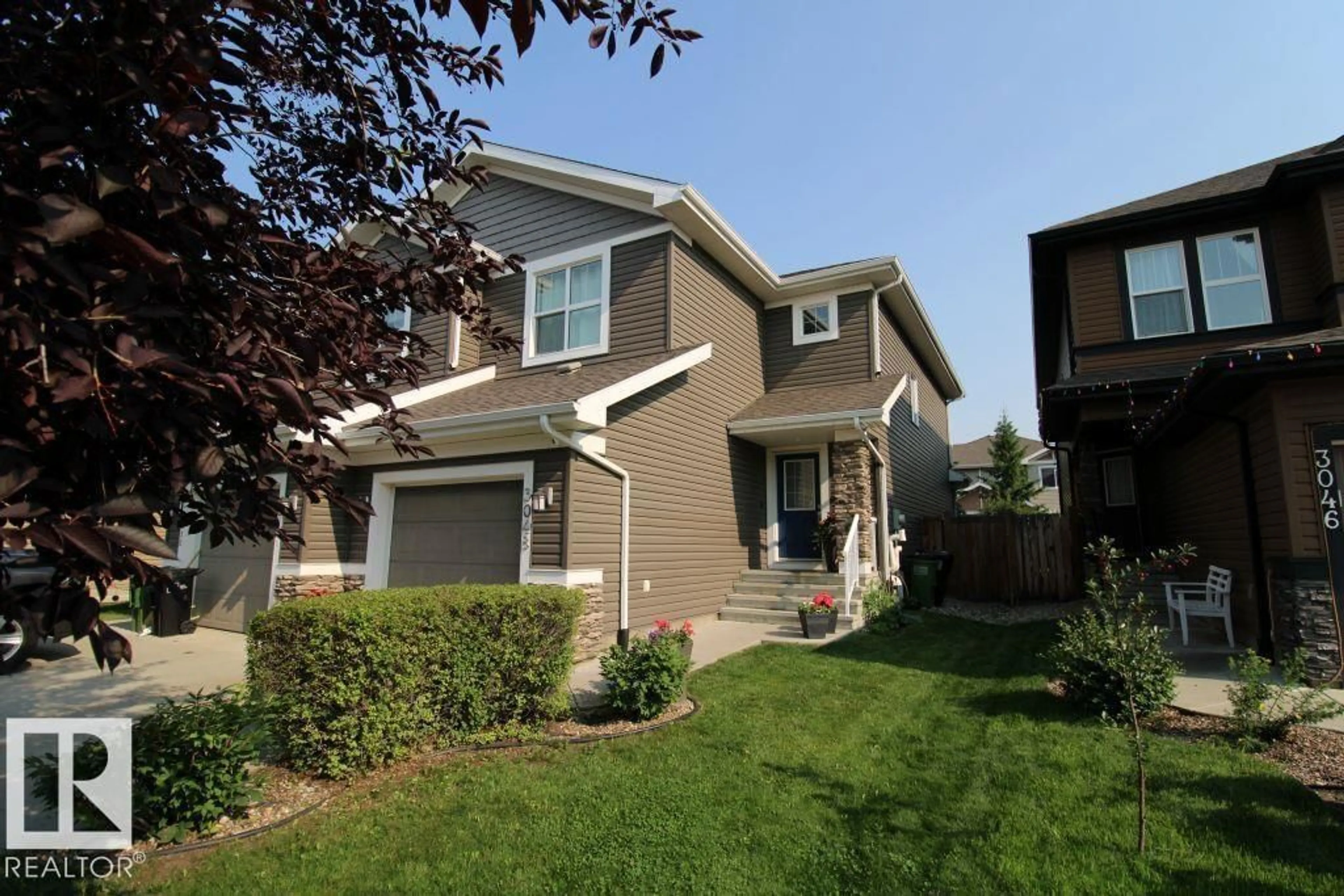 Home with vinyl exterior material, street for 3048 HARVEY CR, Edmonton Alberta T6M0N4