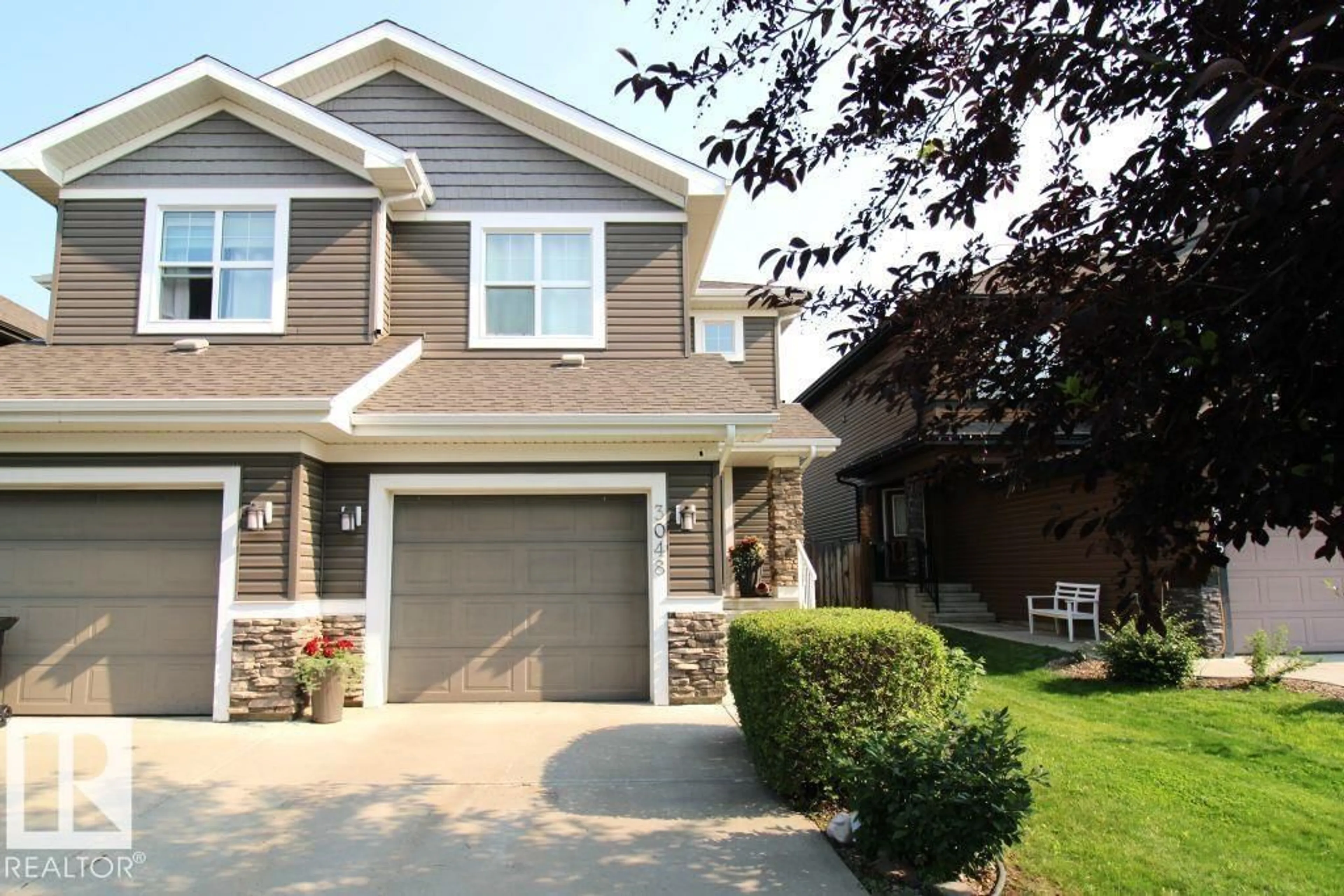 Home with vinyl exterior material, street for 3048 HARVEY CR, Edmonton Alberta T6M0N4