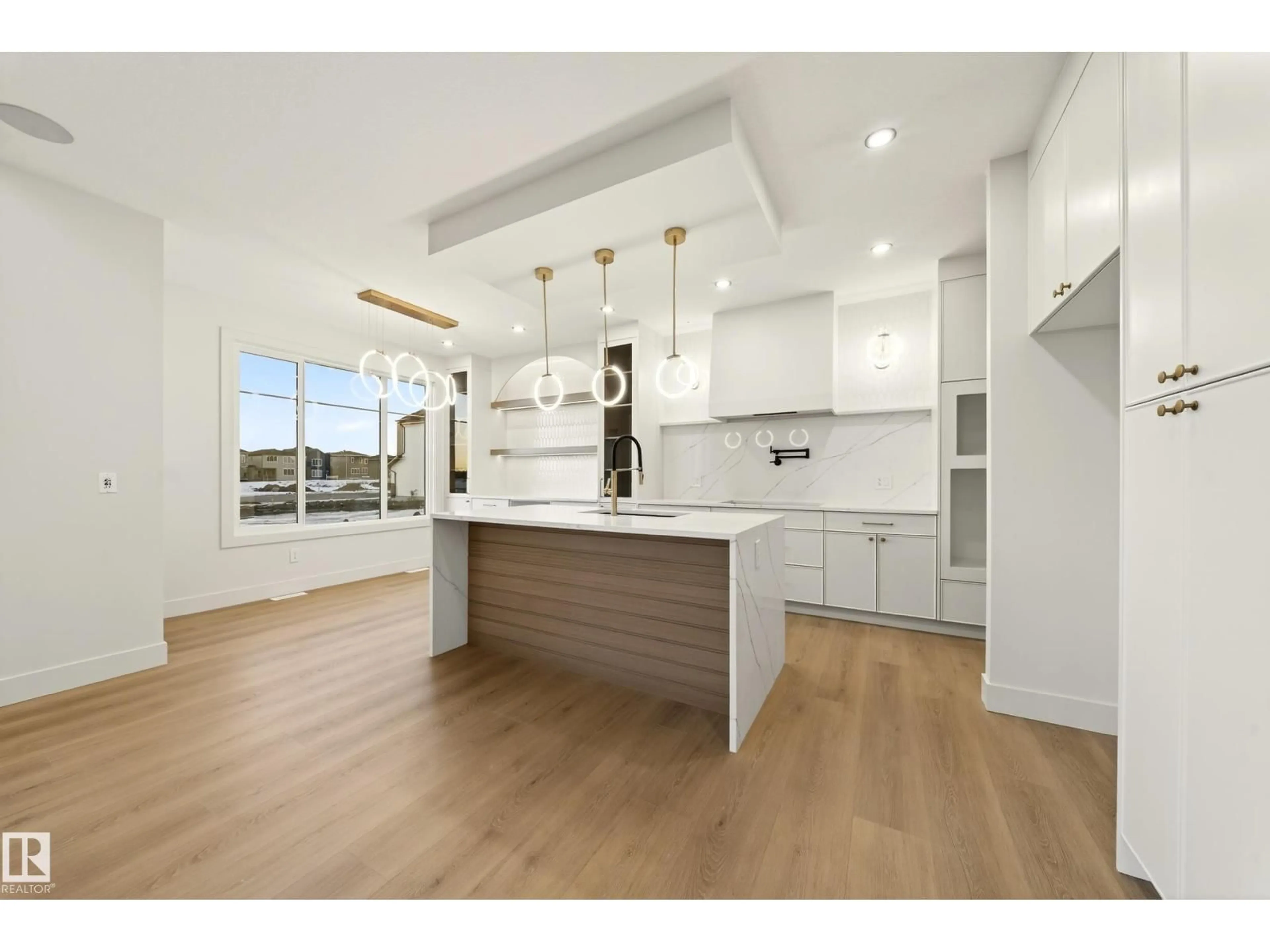 Open concept kitchen, wood/laminate floor for 4276 CHARLES CL, Edmonton Alberta T6W1A7