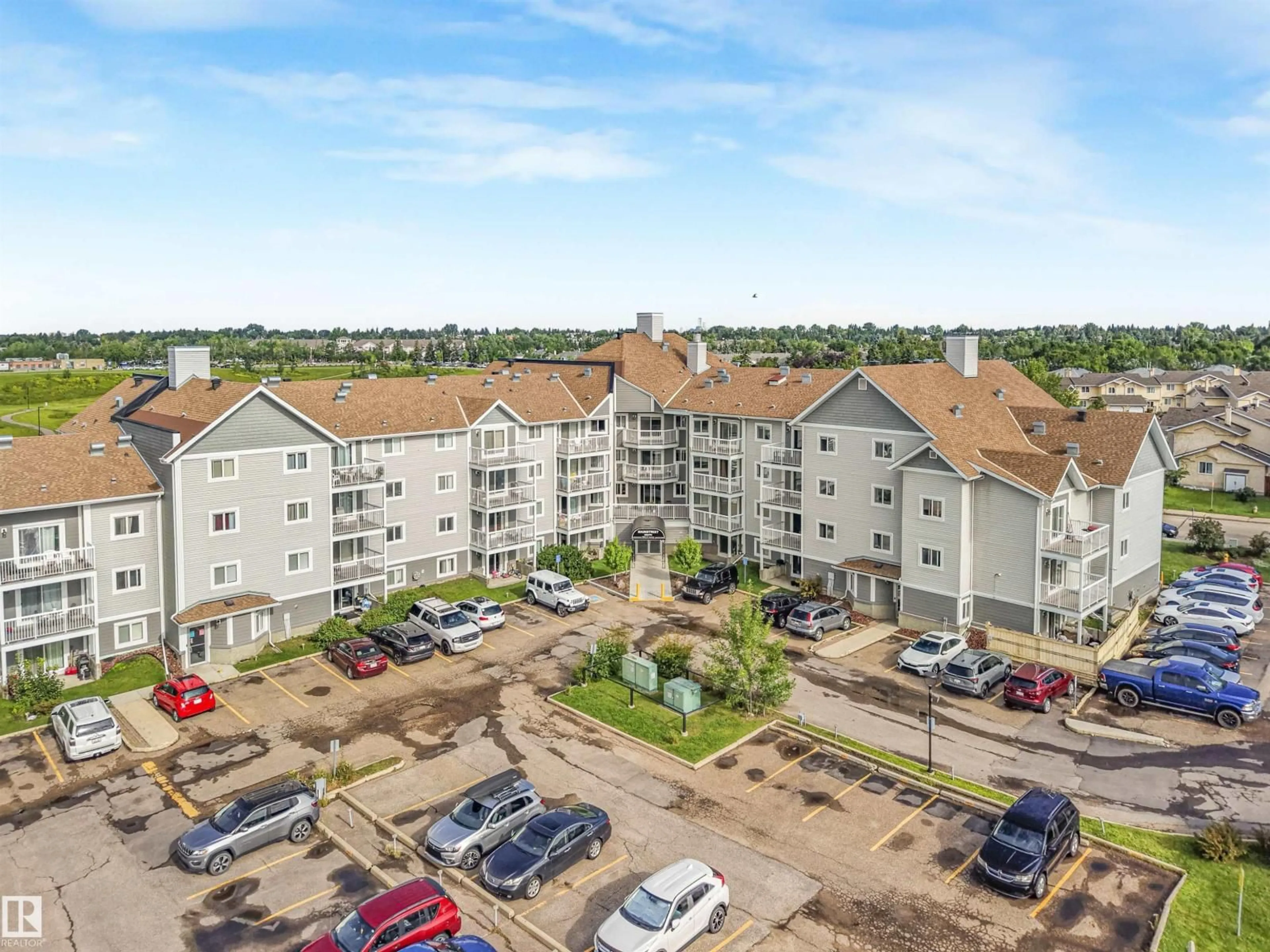 A pic from outside/outdoor area/front of a property/back of a property/a pic from drone, building for #410 - 5065 31 AV, Edmonton Alberta T6L6S5