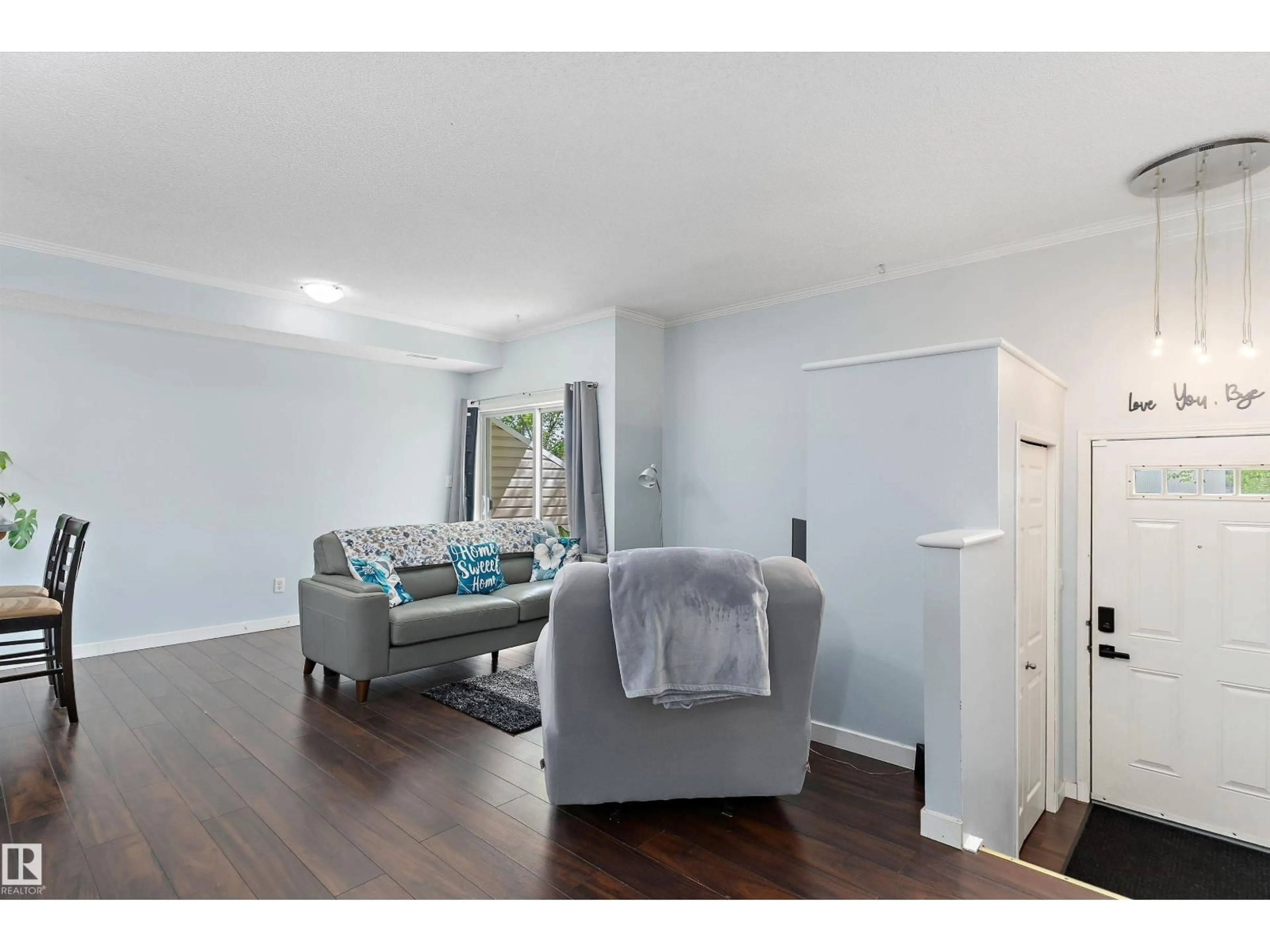 Living room with furniture, wood/laminate floor for 164 - 507 BRIDGEPORT BV, Leduc Alberta T9E0L3