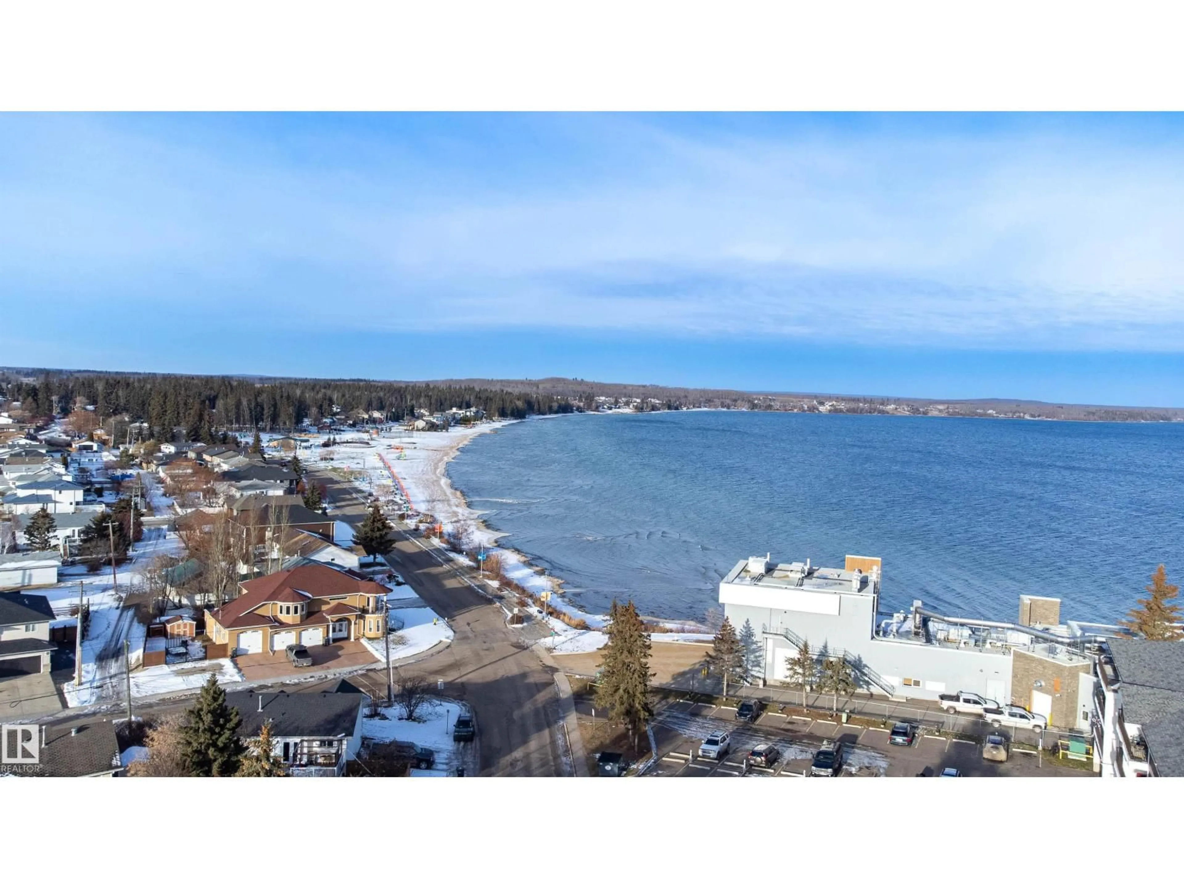 A pic from outside/outdoor area/front of a property/back of a property/a pic from drone, water/lake/river/ocean view for 104 10 ST, Cold Lake Alberta T9M1A6