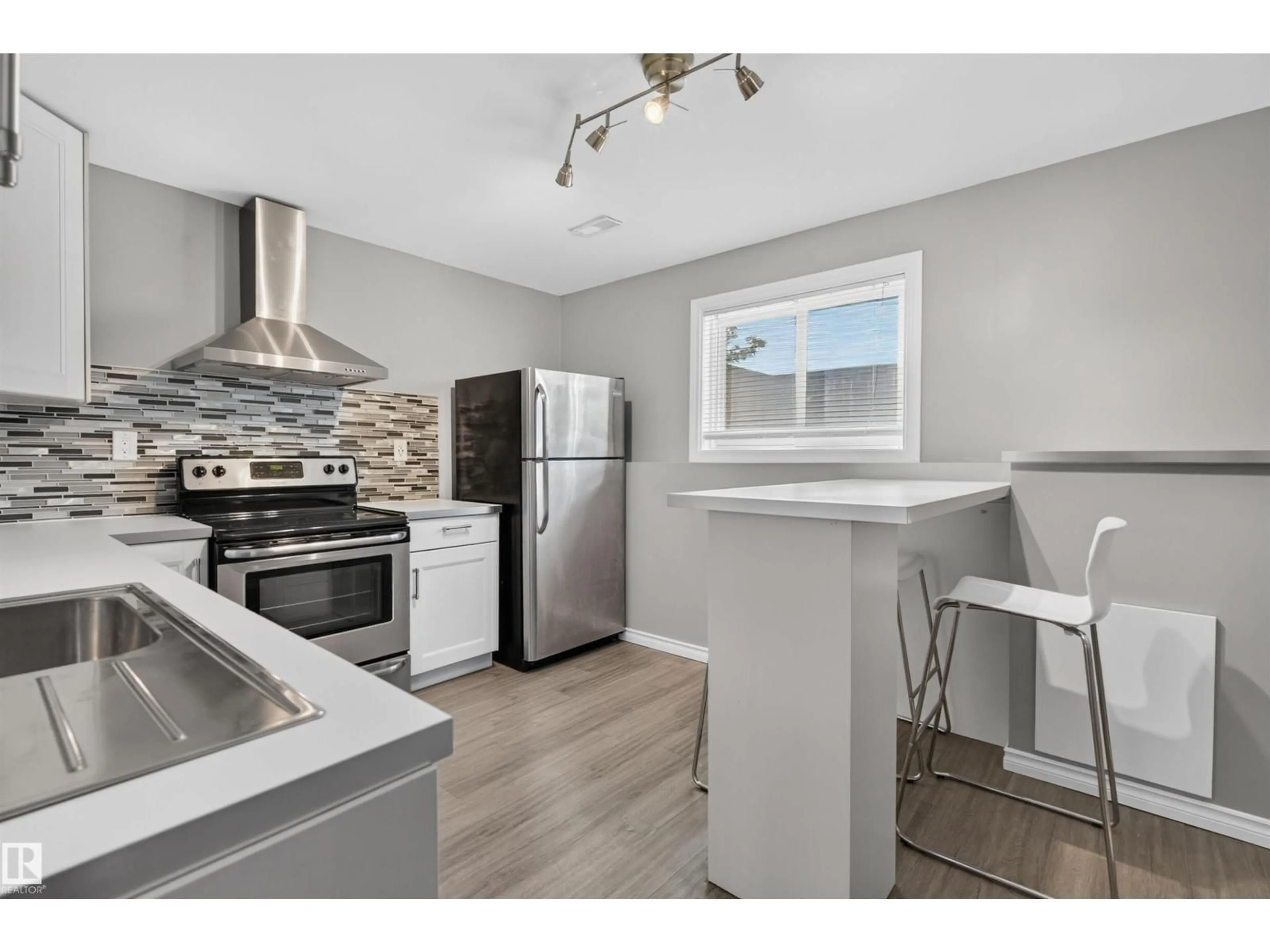 Open concept kitchen, unknown for 18303 76 AV, Edmonton Alberta T5T2L5