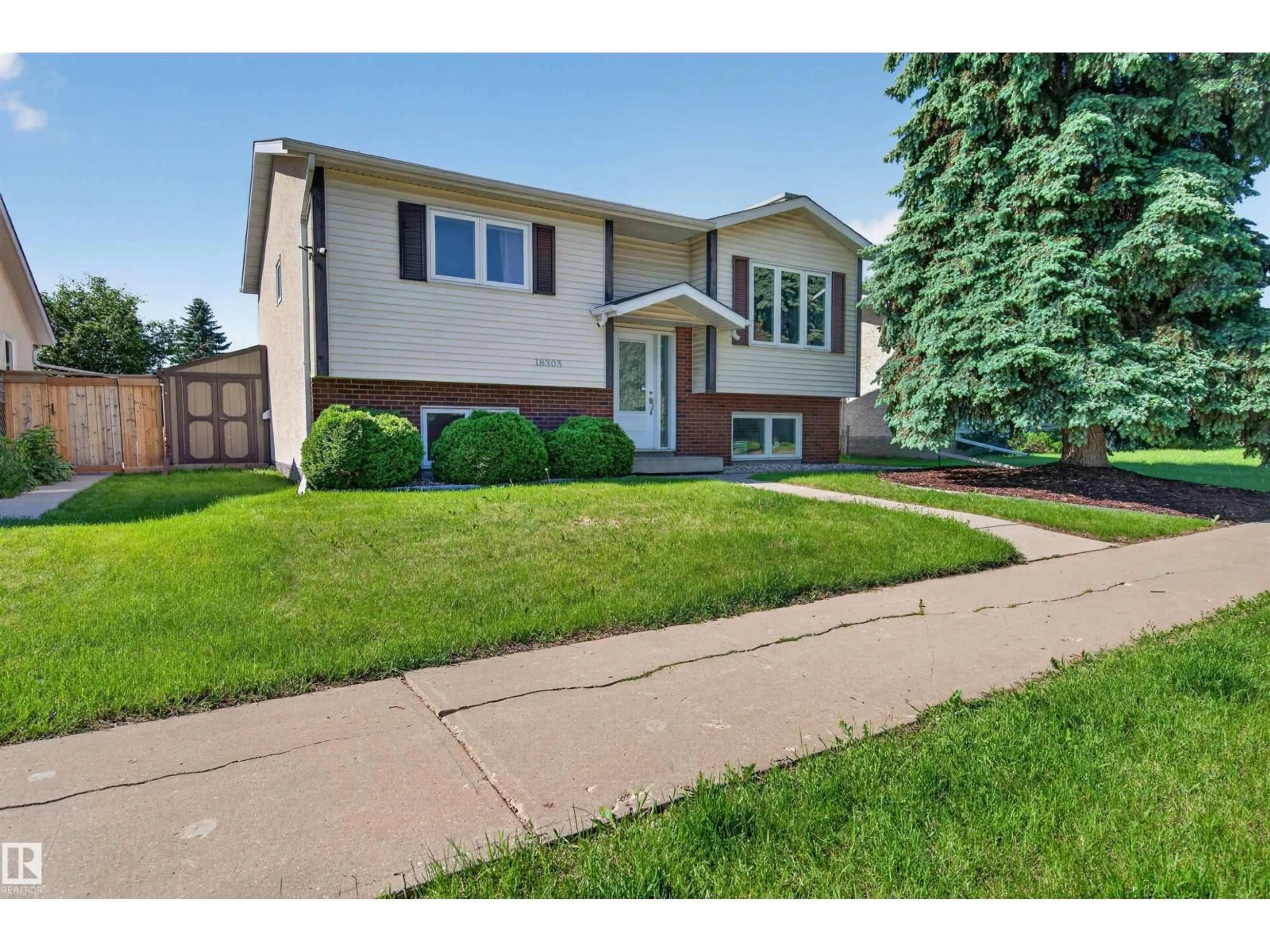 Home with vinyl exterior material, street for 18303 76 AV, Edmonton Alberta T5T2L5