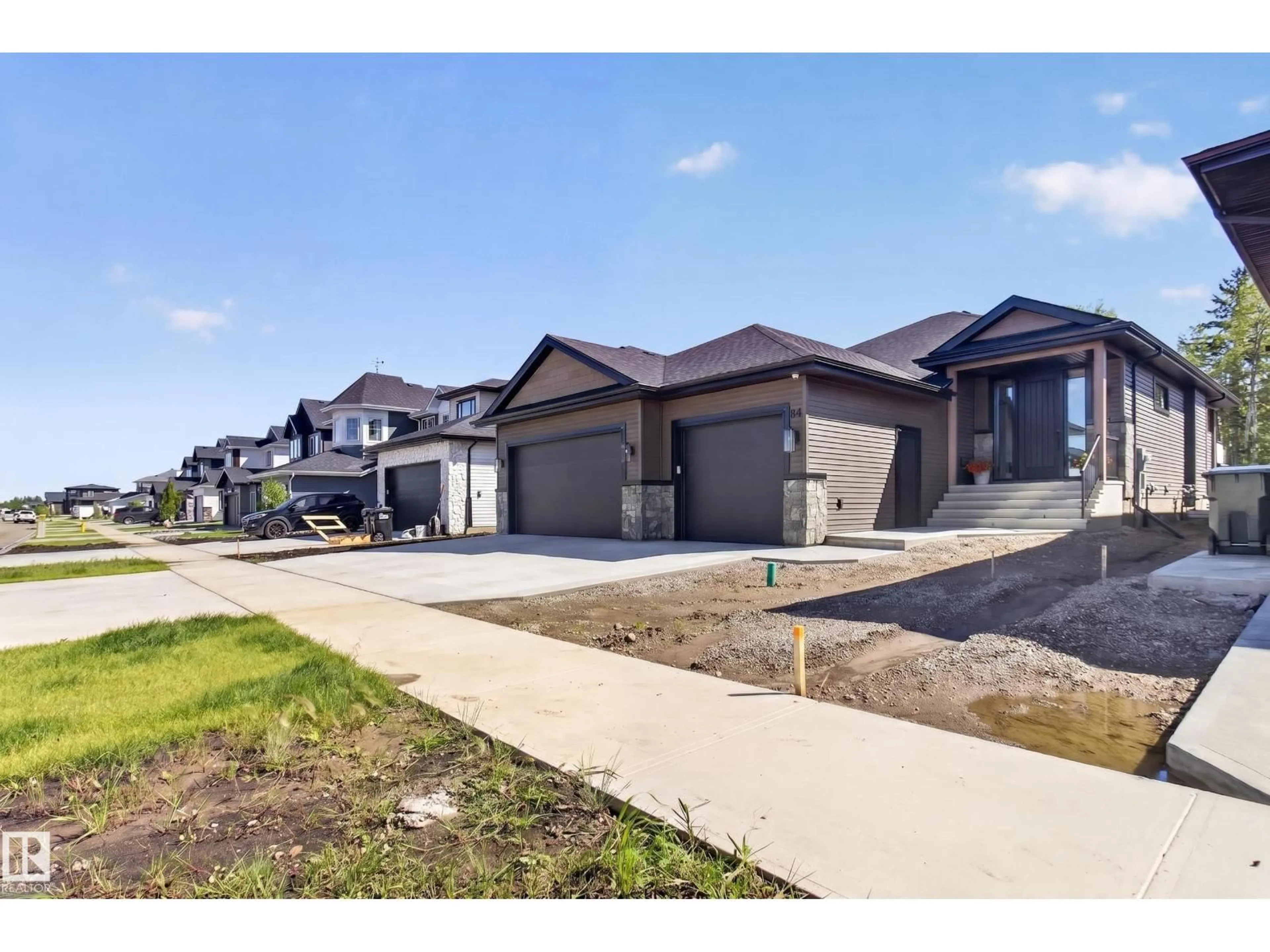 A pic from outside/outdoor area/front of a property/back of a property/a pic from drone, street for 84 HARVEST CR, Ardrossan Alberta T8E0B5
