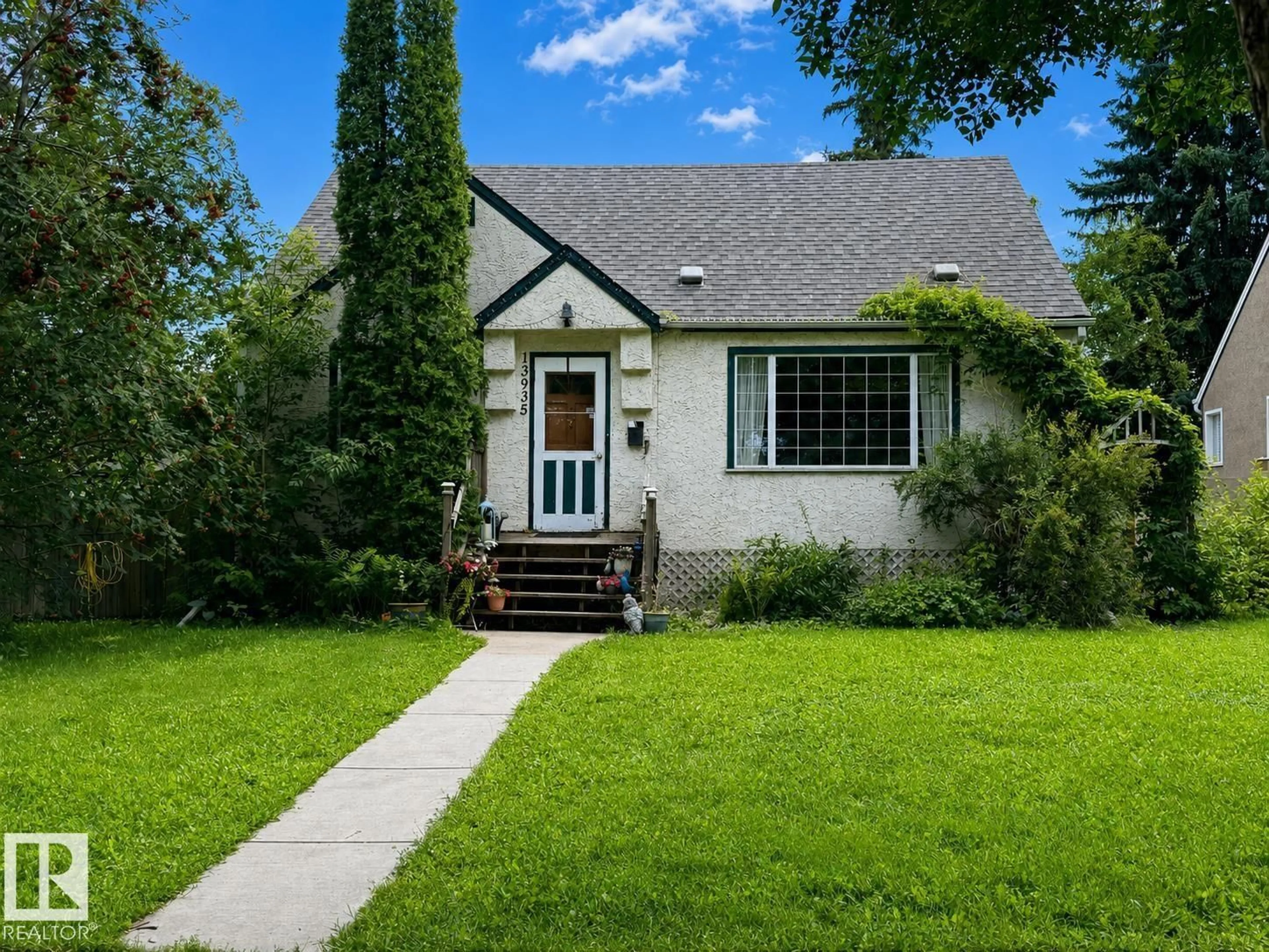 Home with vinyl exterior material, street for 13935 107A AV, Edmonton Alberta T5M2A8