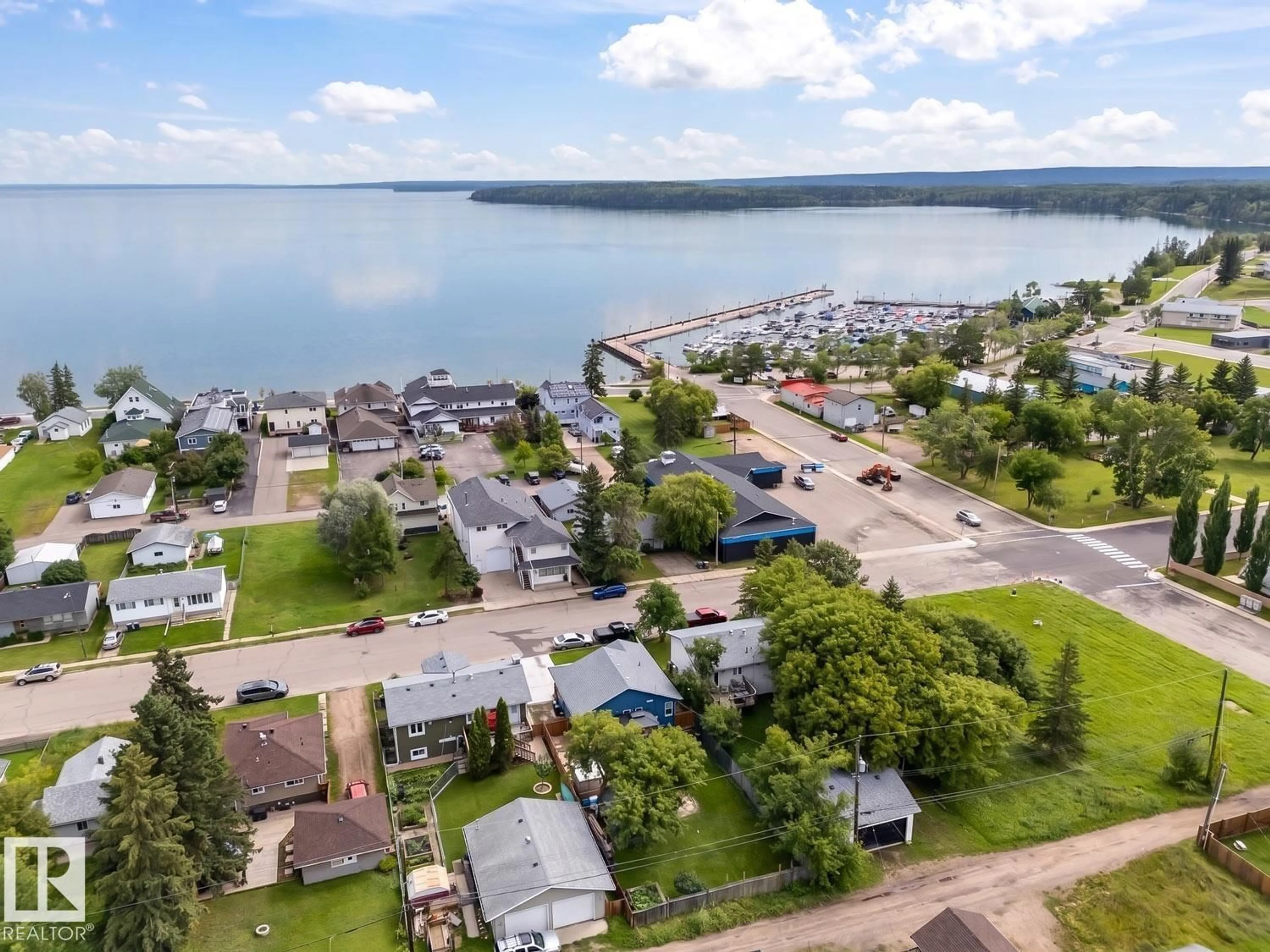 A pic from outside/outdoor area/front of a property/back of a property/a pic from drone, water/lake/river/ocean view for 615 10 ST, Cold Lake Alberta T9M1B1