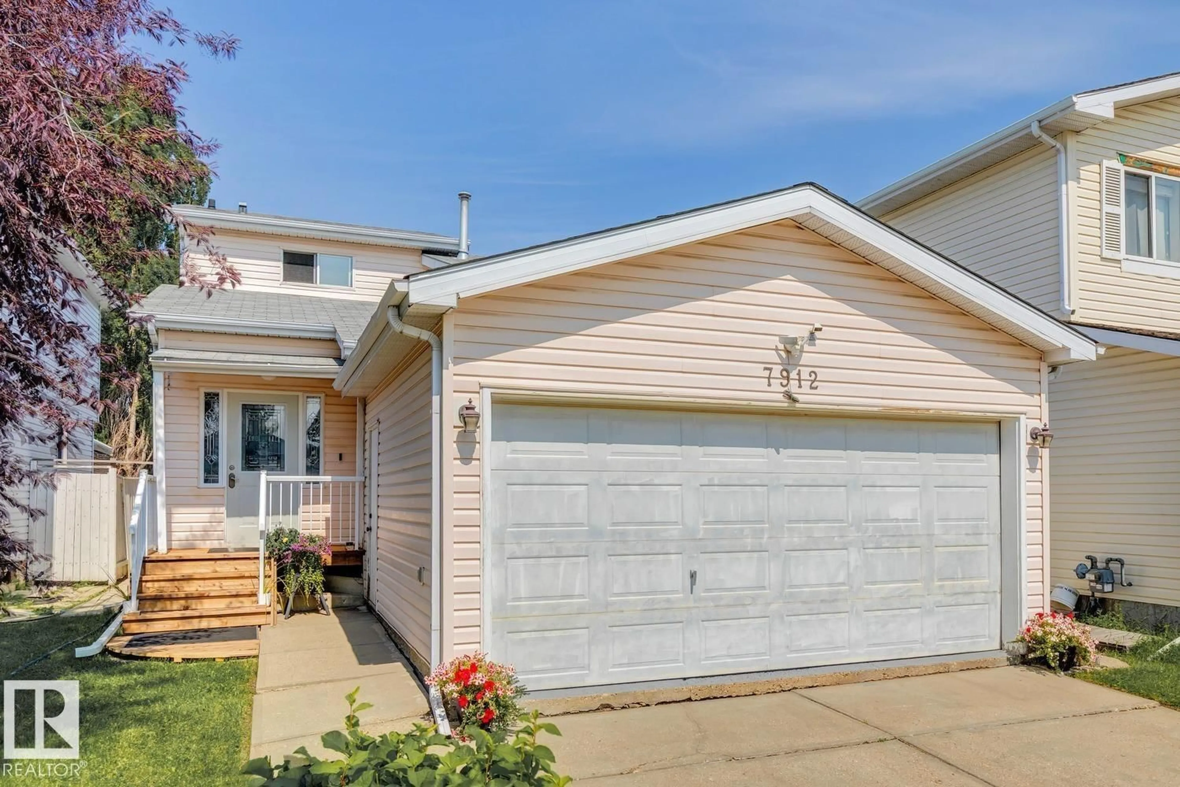 Home with vinyl exterior material, street for 7912 154 AV, Edmonton Alberta T5Z2Z2