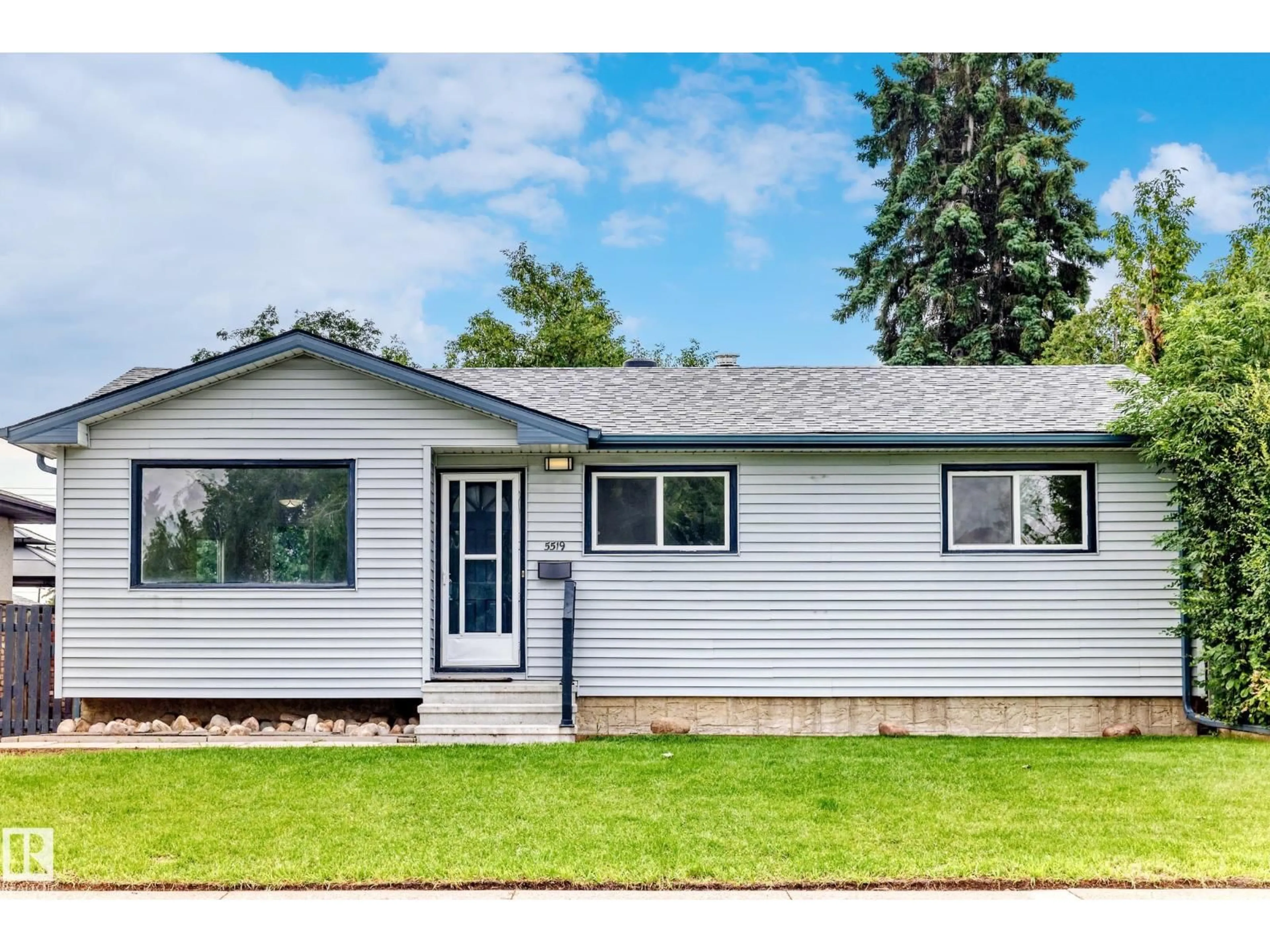 Home with vinyl exterior material, street for 5519 142 AV, Edmonton Alberta T5A1J1