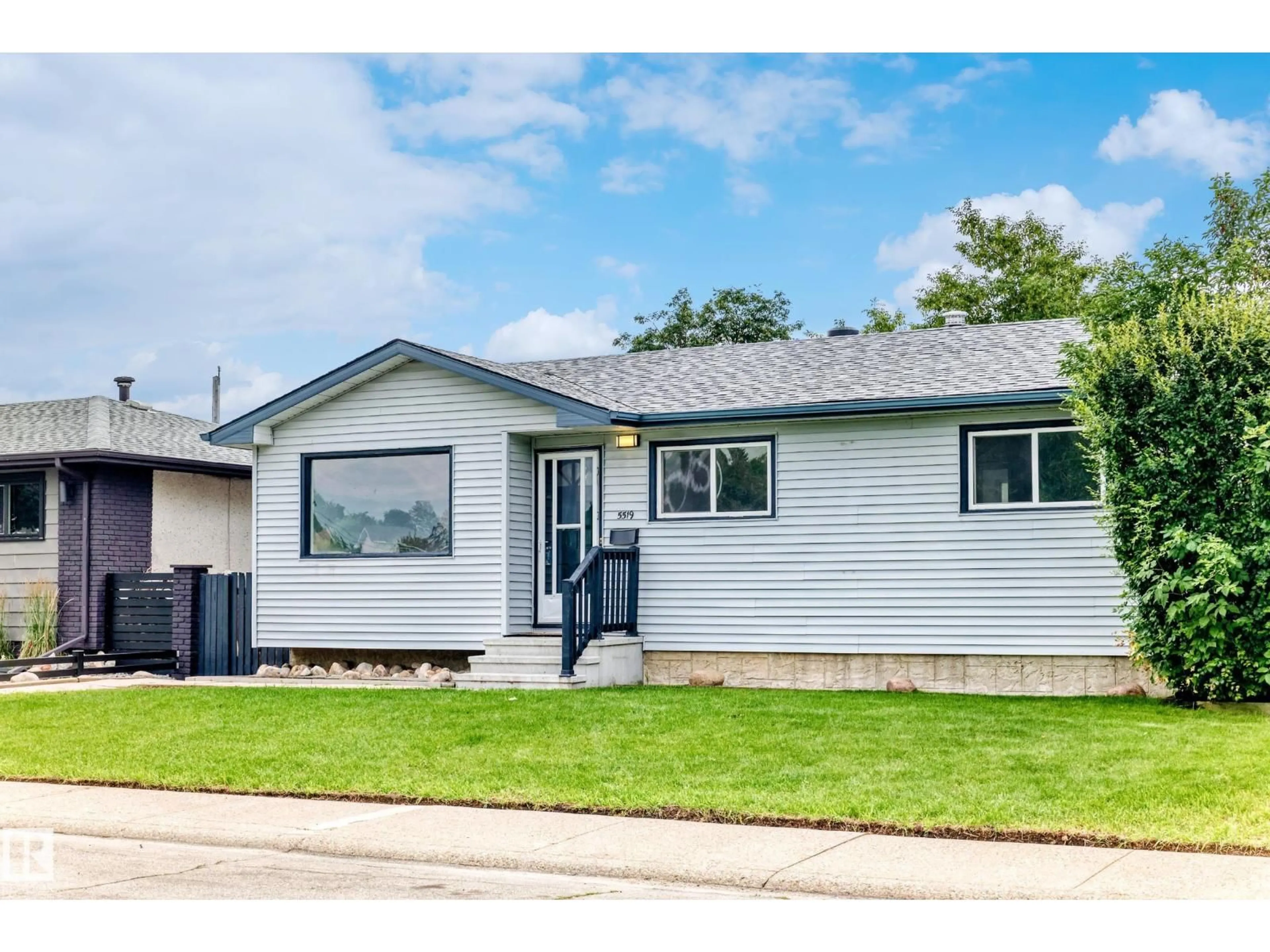 Home with vinyl exterior material, street for 5519 142 AV, Edmonton Alberta T5A1J1