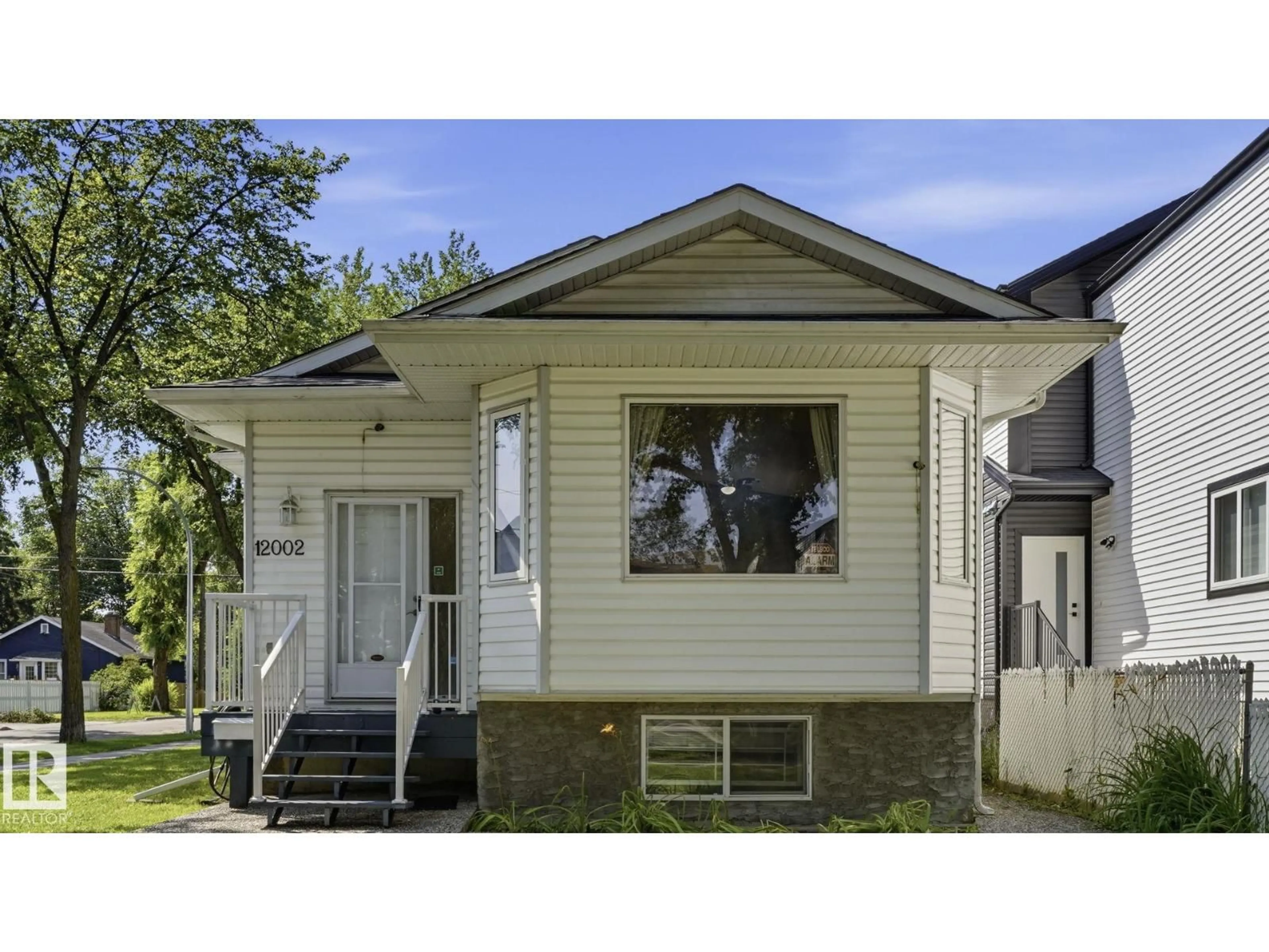 Home with vinyl exterior material, street for NW - 12002 91 ST, Edmonton Alberta T5B4B8