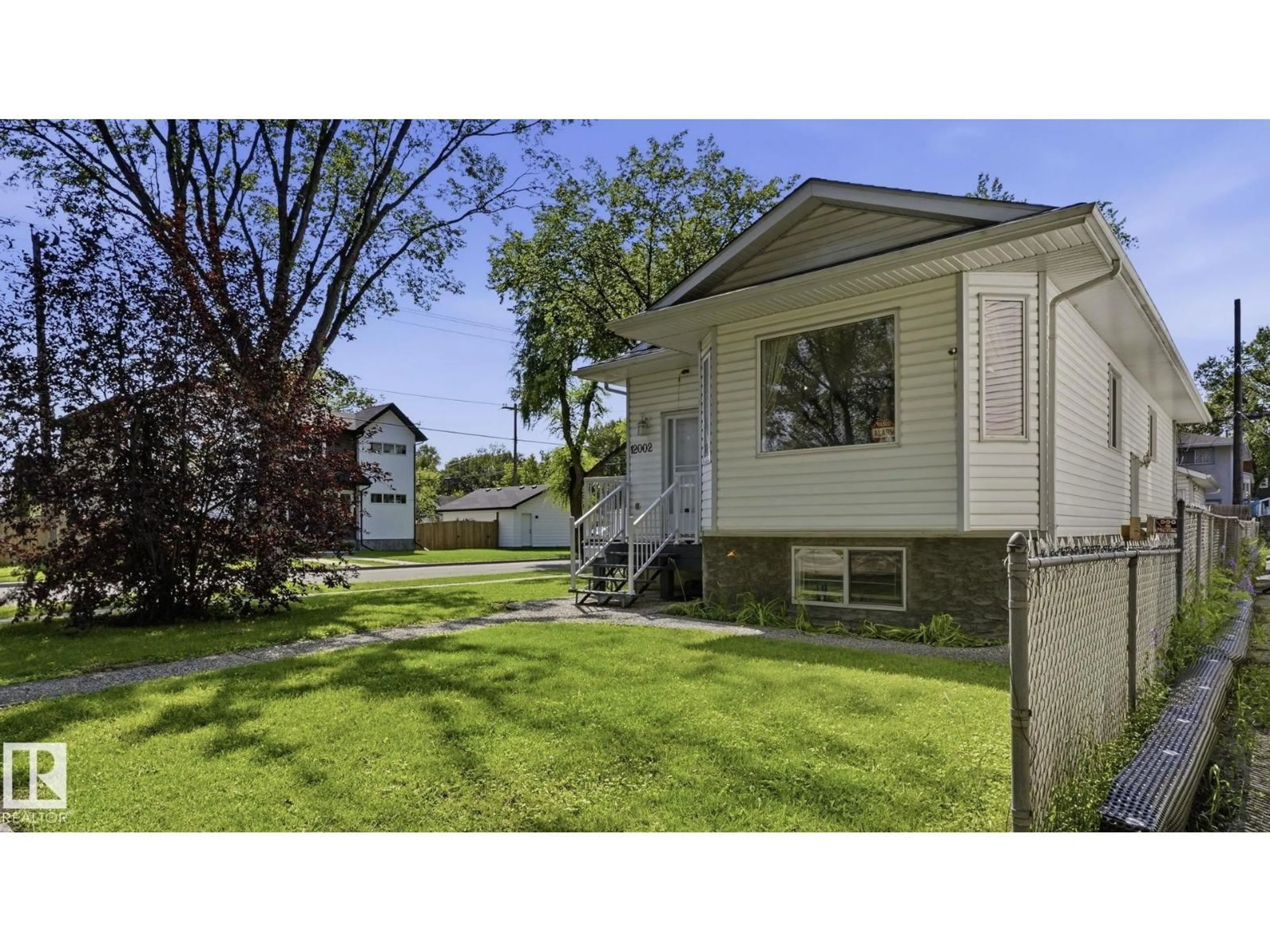 Home with vinyl exterior material, street for NW - 12002 91 ST, Edmonton Alberta T5B4B8