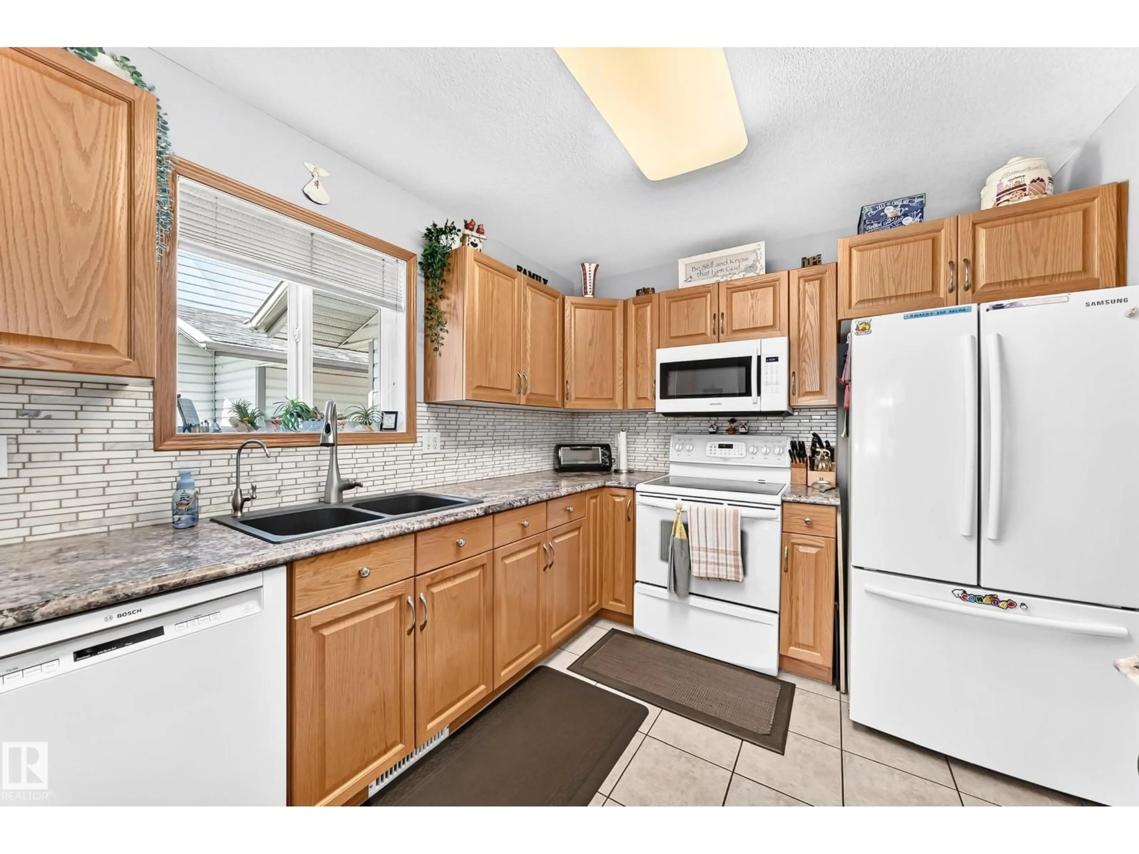 Standard kitchen, ceramic/tile floor for #204 - 4807 43A AV, Leduc Alberta T9E8J6