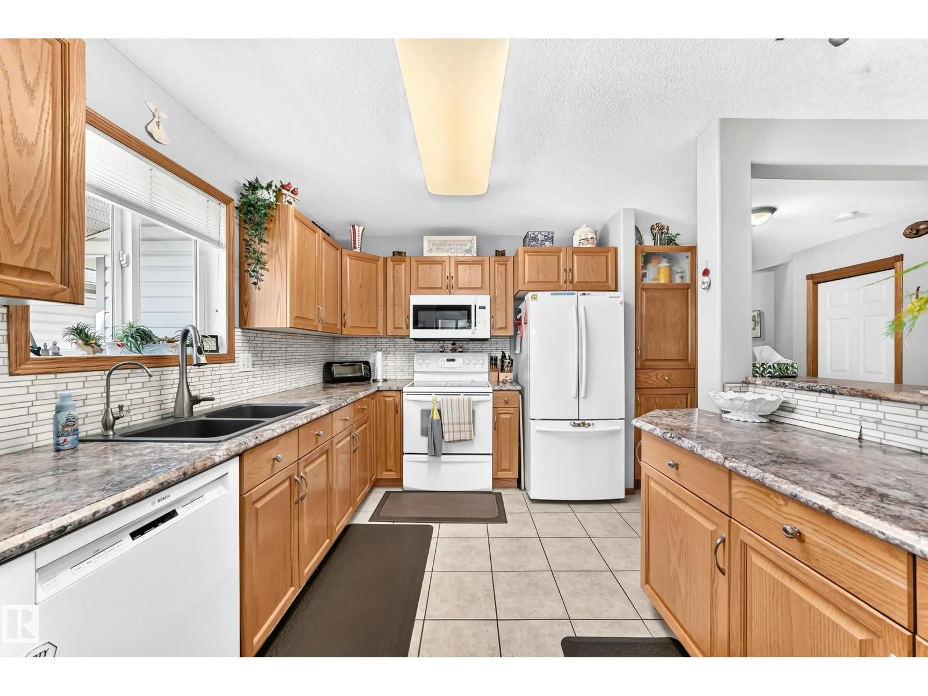 Standard kitchen, ceramic/tile floor for #204 - 4807 43A AV, Leduc Alberta T9E8J6