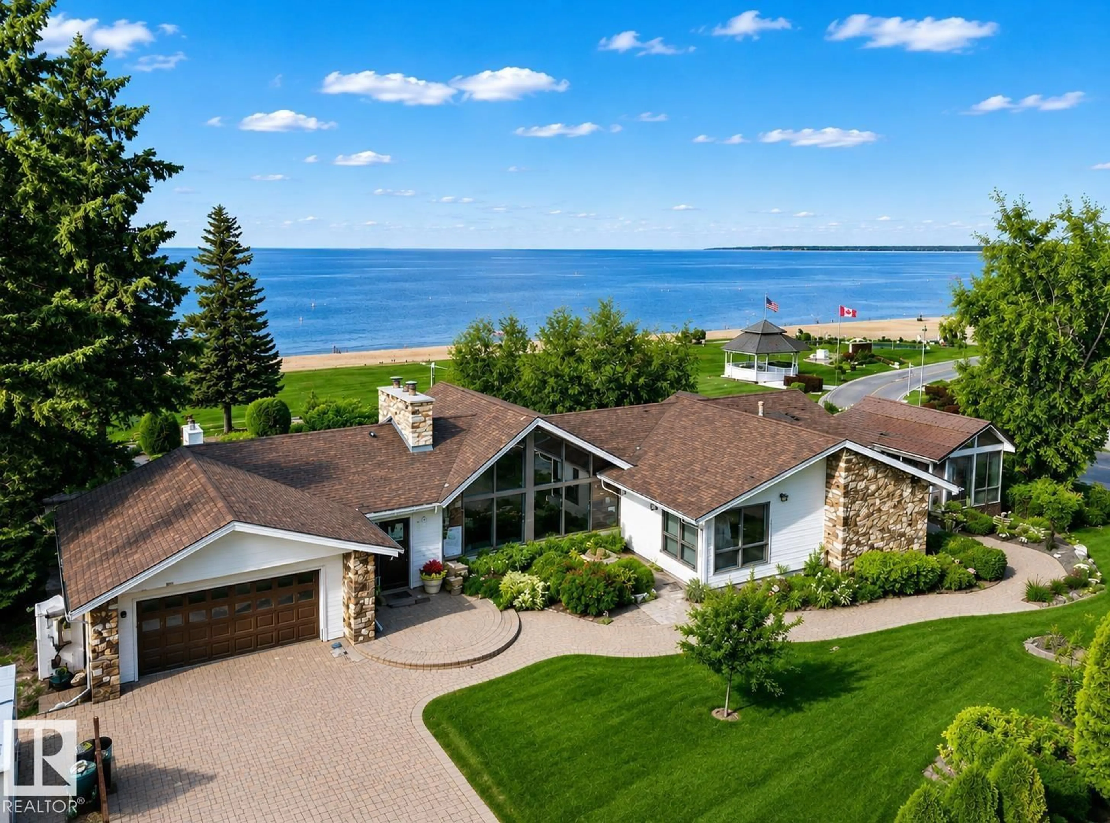 A pic from outside/outdoor area/front of a property/back of a property/a pic from drone, water/lake/river/ocean view for 203 PINE AV, Cold Lake Alberta T9M1E5