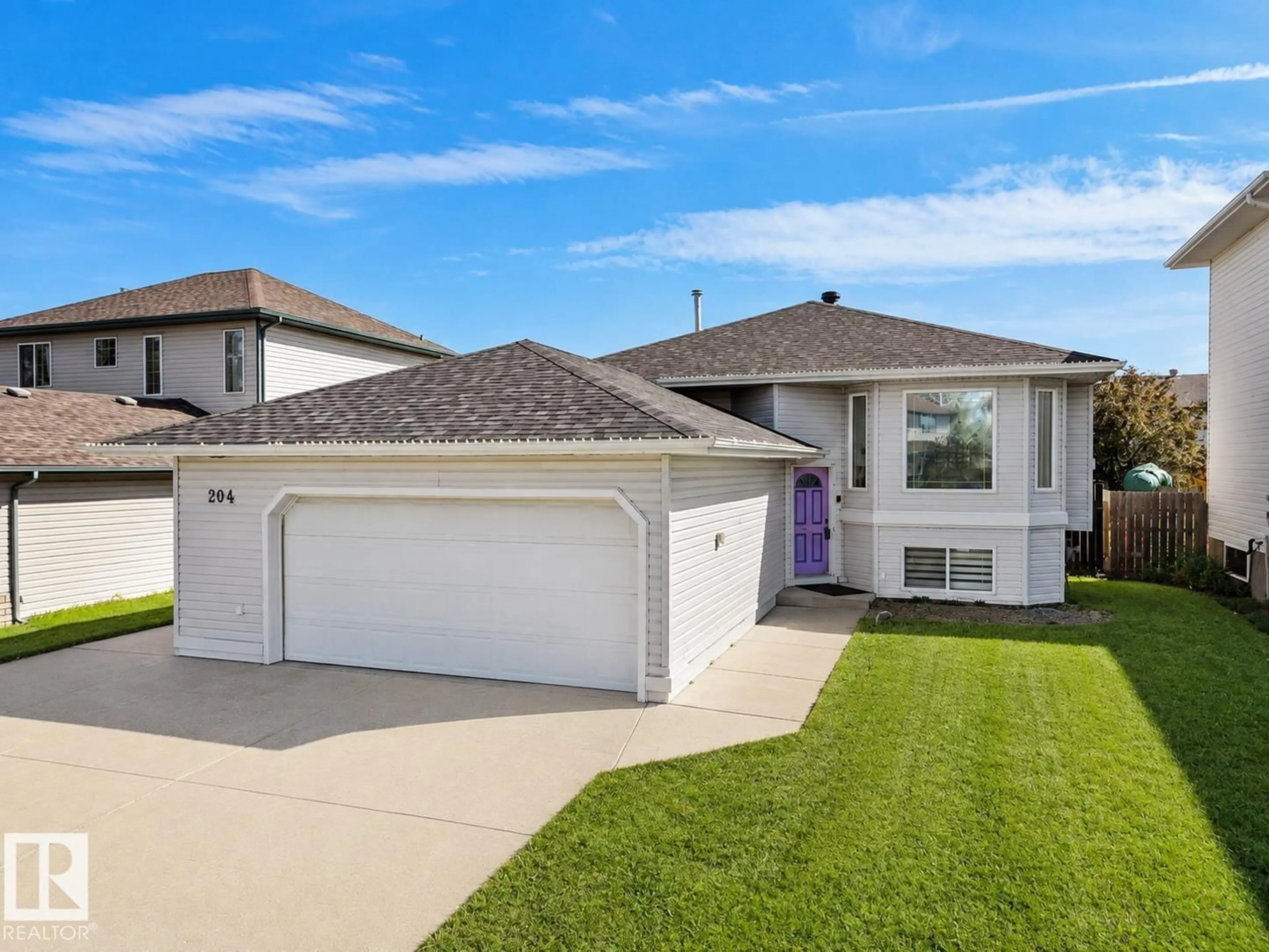 Home with vinyl exterior material, street for 204 WESTMEWS DR, Fort Saskatchewan Alberta T8L4J2
