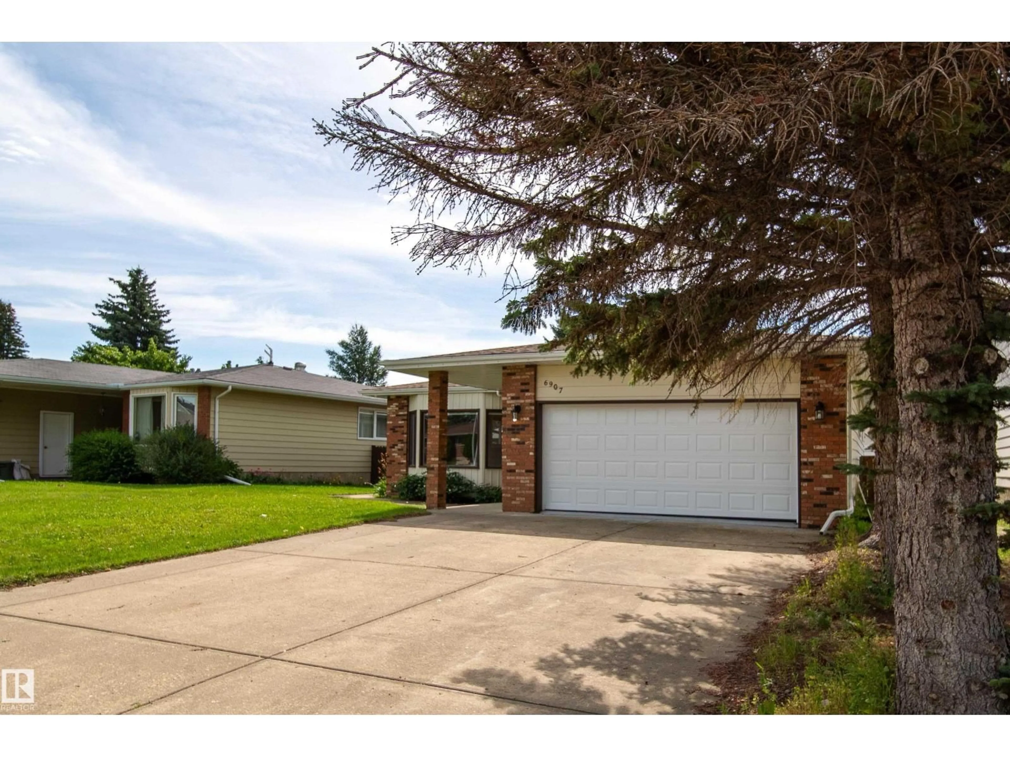 Home with brick exterior material, street for 6907 19 AV, Edmonton Alberta T6K2G7
