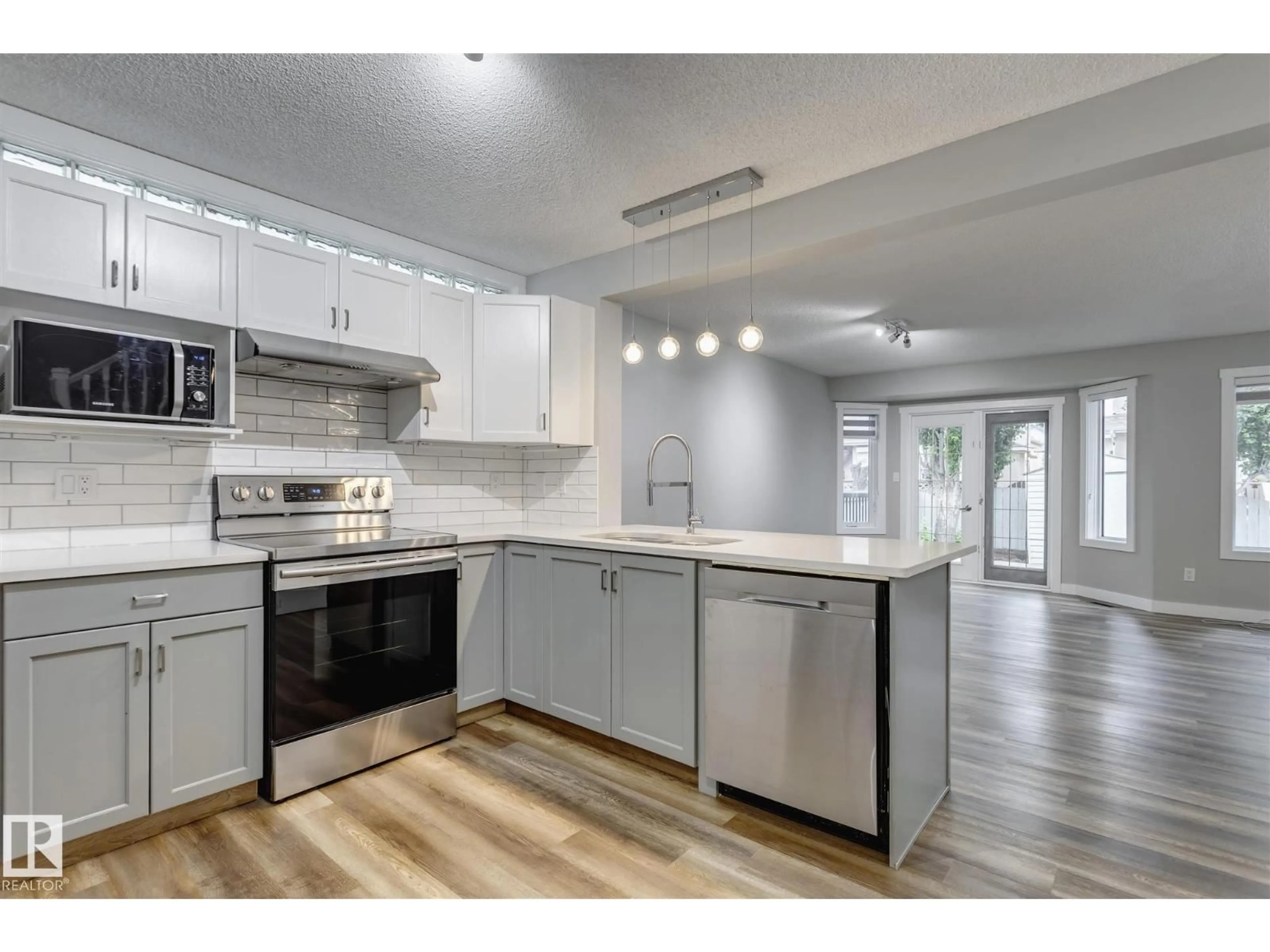 Open concept kitchen, unknown for NW - 15819 69 ST, Edmonton Alberta T5Z3A5