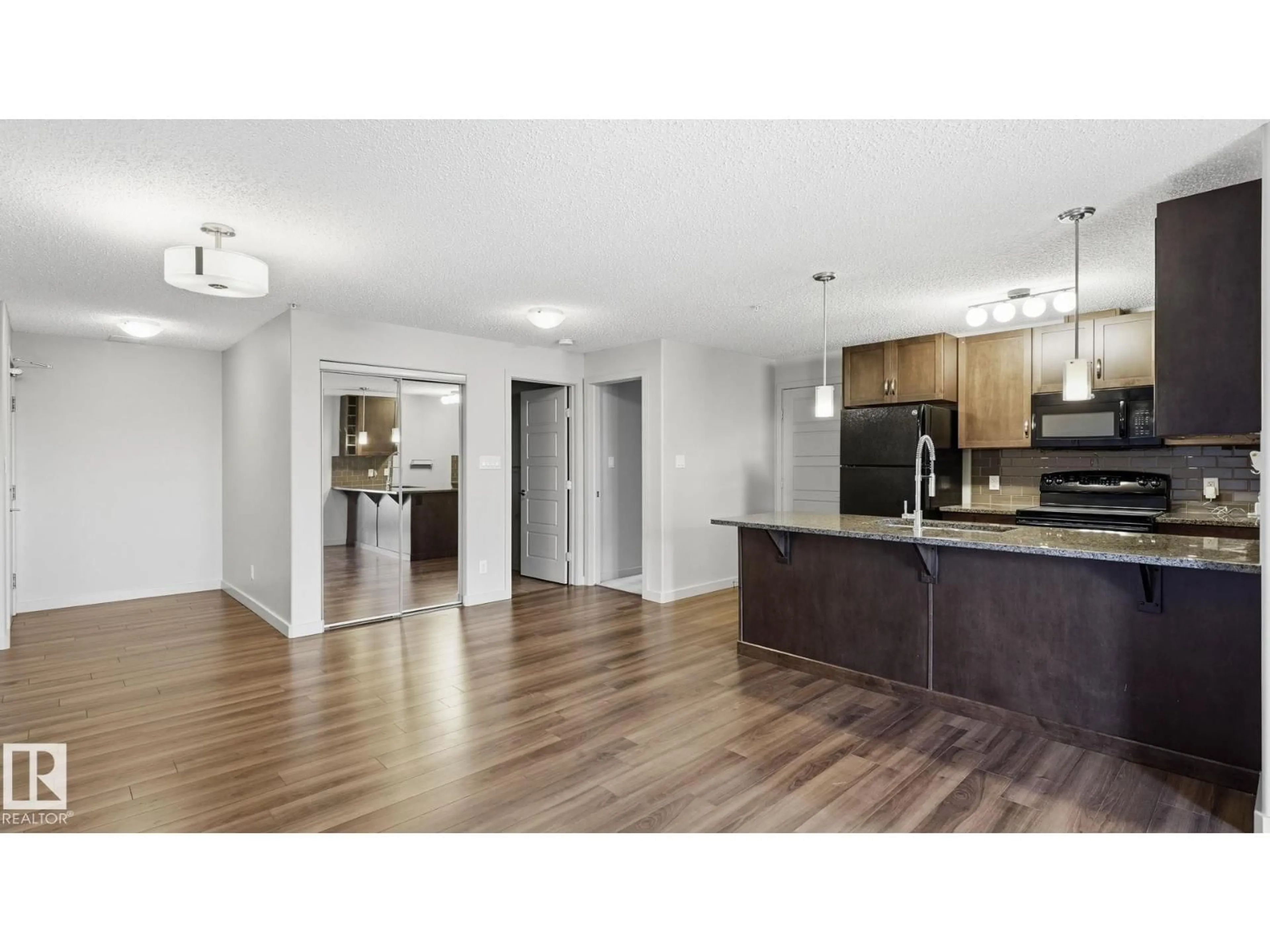 Open concept kitchen, wood/laminate floor for 361 - 7805 71 ST, Edmonton Alberta T6B3V6