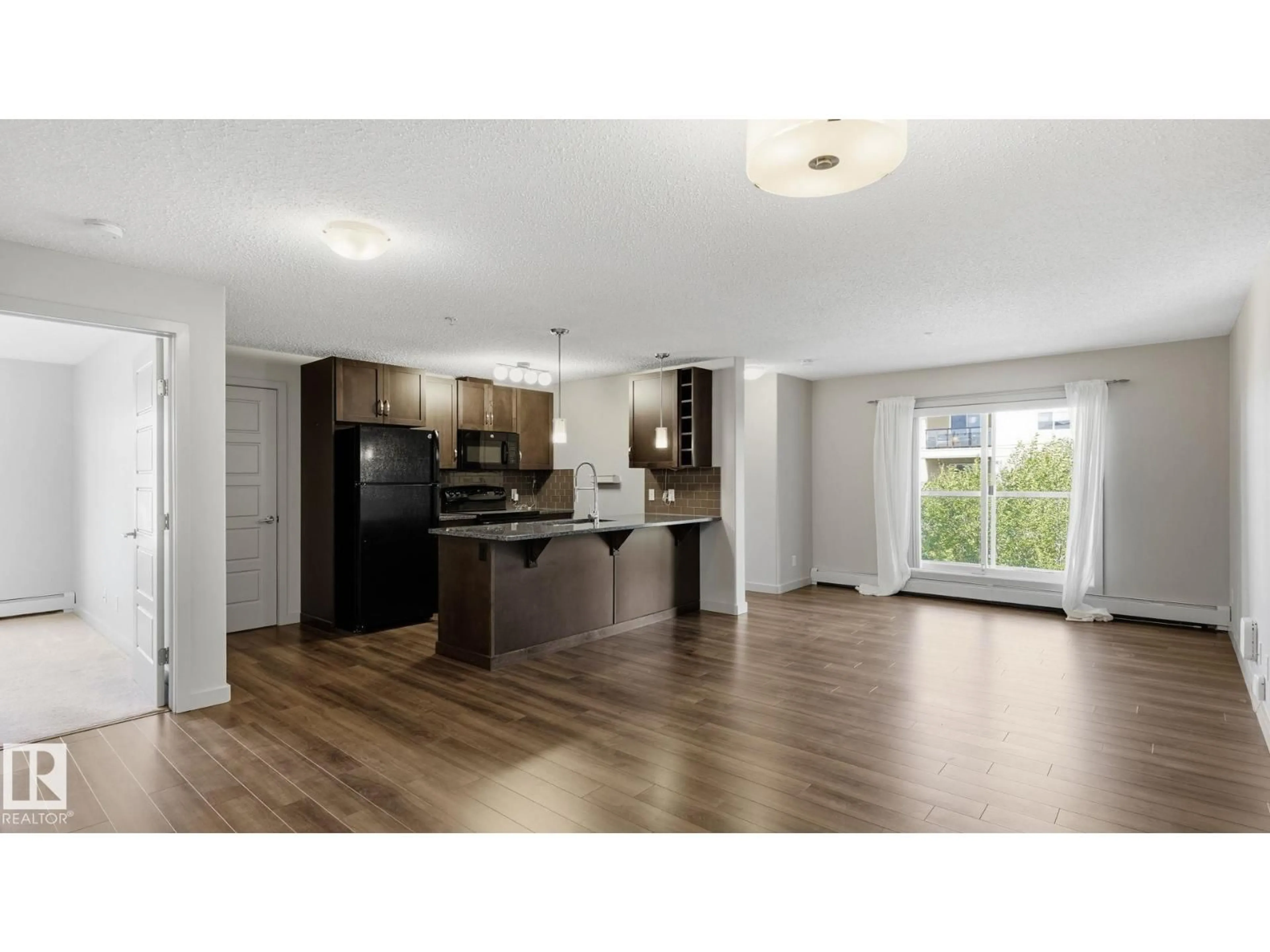 Open concept kitchen, wood/laminate floor for 361 - 7805 71 ST, Edmonton Alberta T6B3V6